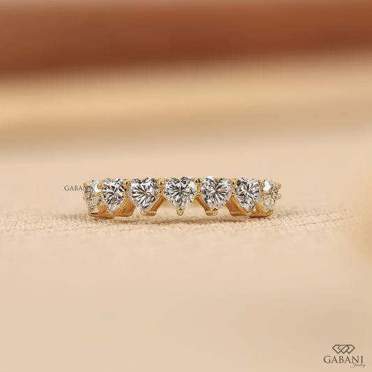 seven stone heart shaped lab grown diamond band in yellow gold