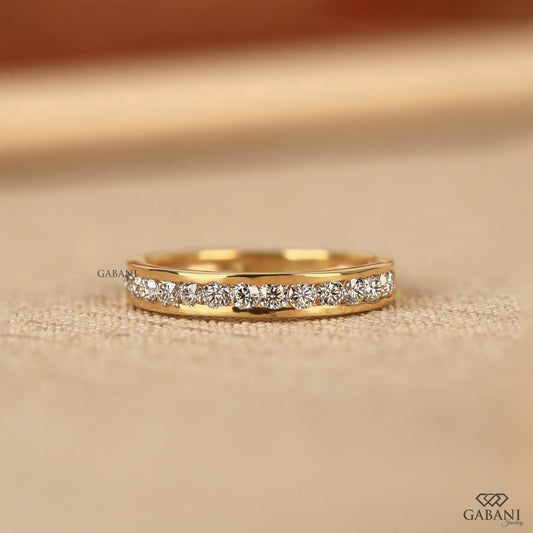 round lab grown diamond channel set half eternity band in 14k yellow gold