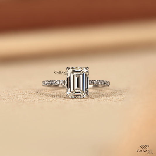 emerald cut lab created diamond solitaire ring in white gold with prong setting and hidden halo design