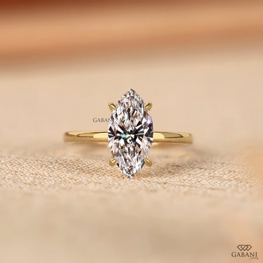 gabani jewelry marquise cut lab grown diamond solitaire ring in gold with prong set basket and simple pipe shank