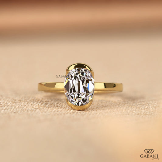 Old mine oval lab grown diamond solitaire ring in yellow gold with half bezel setting, comfort fit design