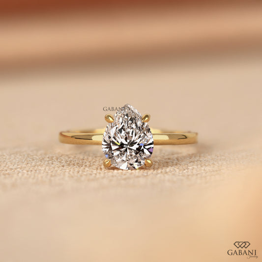 pear cut lab grown diamond solitaire ring in solid yellow gold with sleek comfort fit
