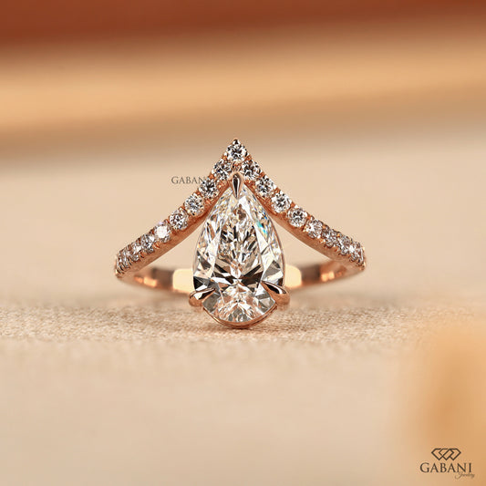 Pear cut lab grown diamond V shaped engagement ring in rose gold with pavé band