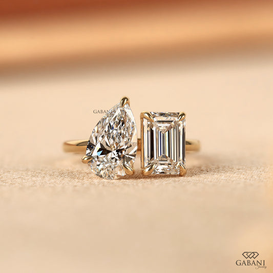 Emerald and pear cut lab grown diamond Toi et Moi ring in 14K solid yellow gold with two stone claw prong design