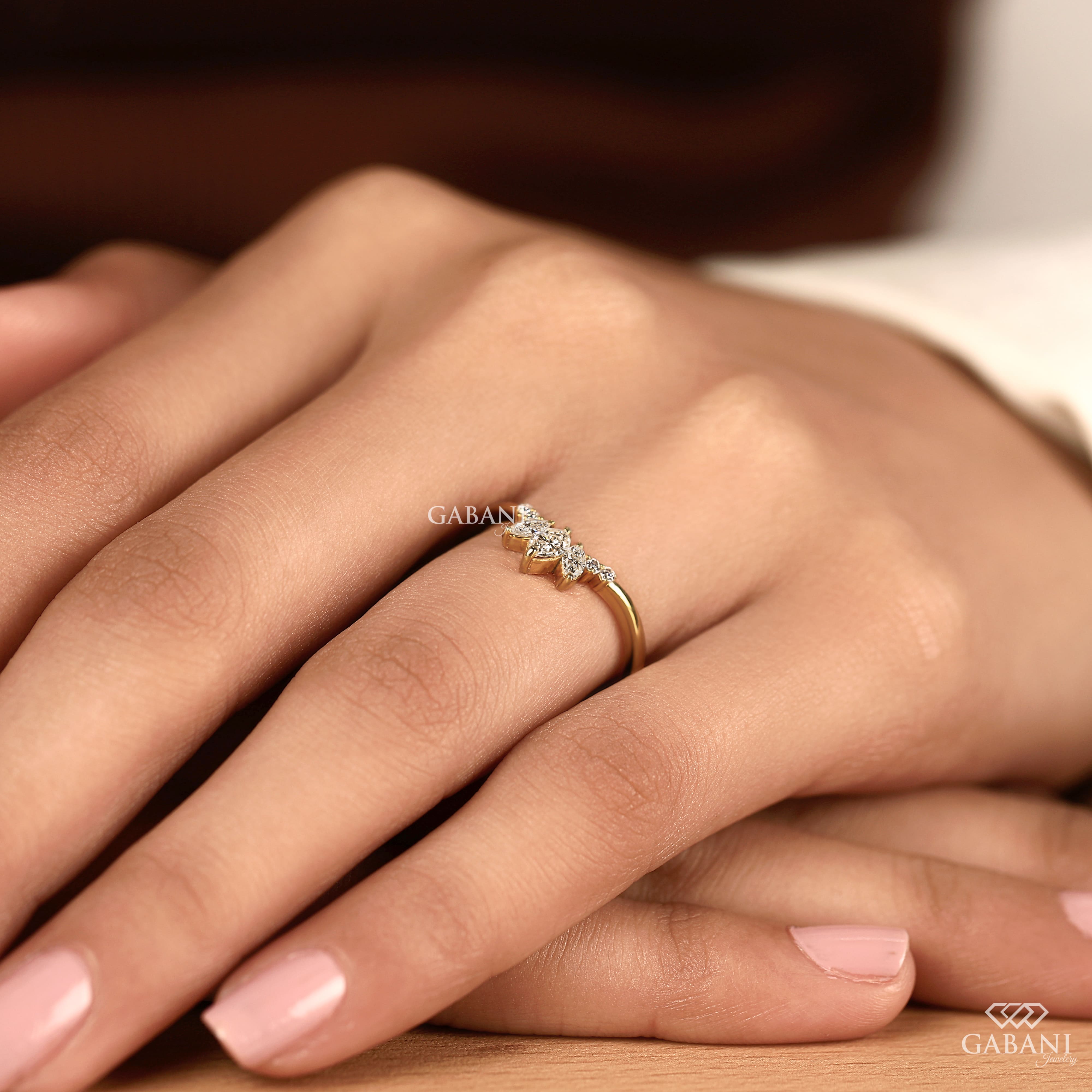 Marquise and round cut lab grown diamond curved wedding band in 14K yellow gold with a contour design, ideal for stacking with an engagement ring.