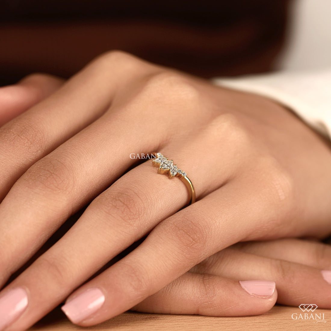 Marquise and round cut lab grown diamond curved wedding band in 14K yellow gold with a contour design, ideal for stacking with an engagement ring.