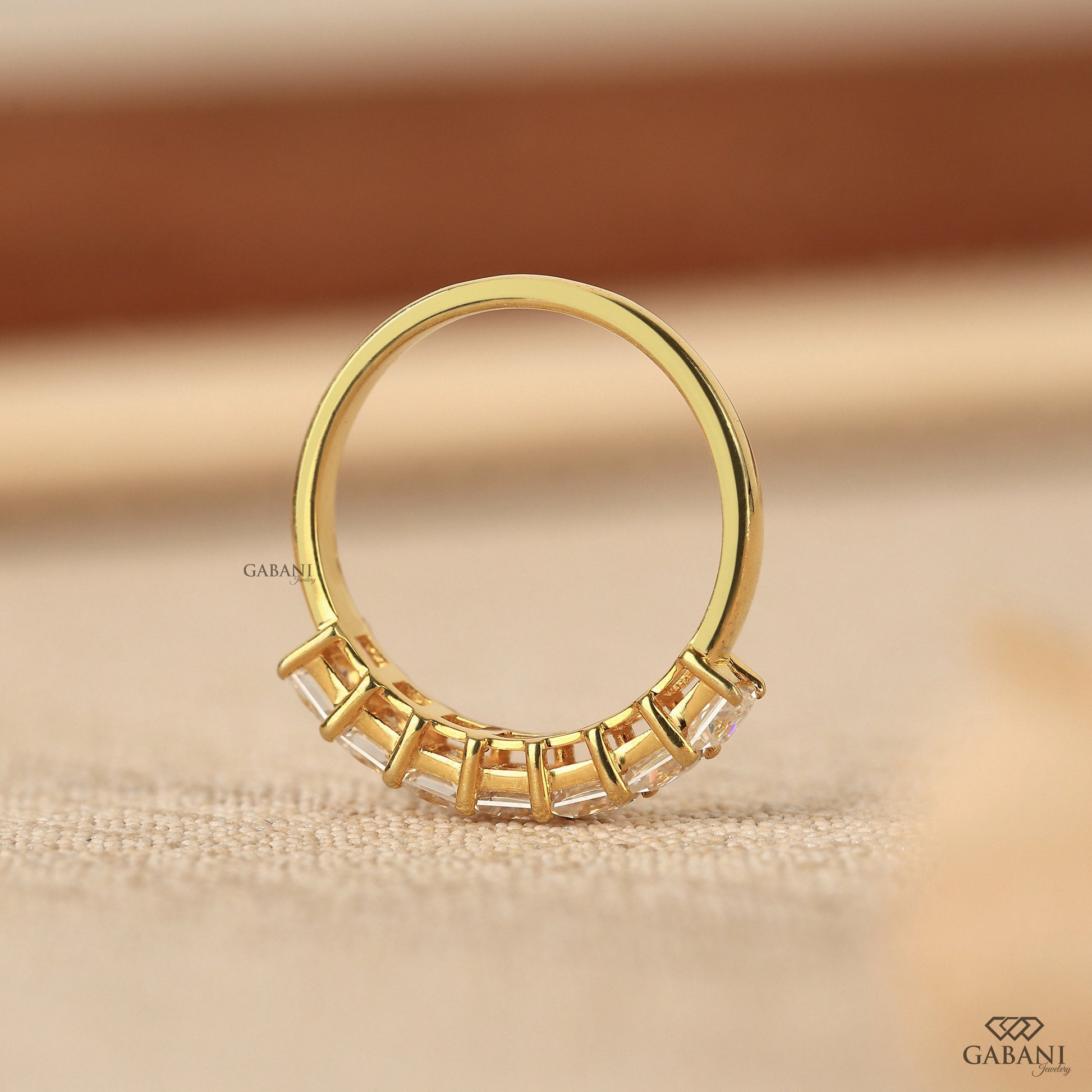 Straight diamond band featuring seven princess cut lab grown diamonds
