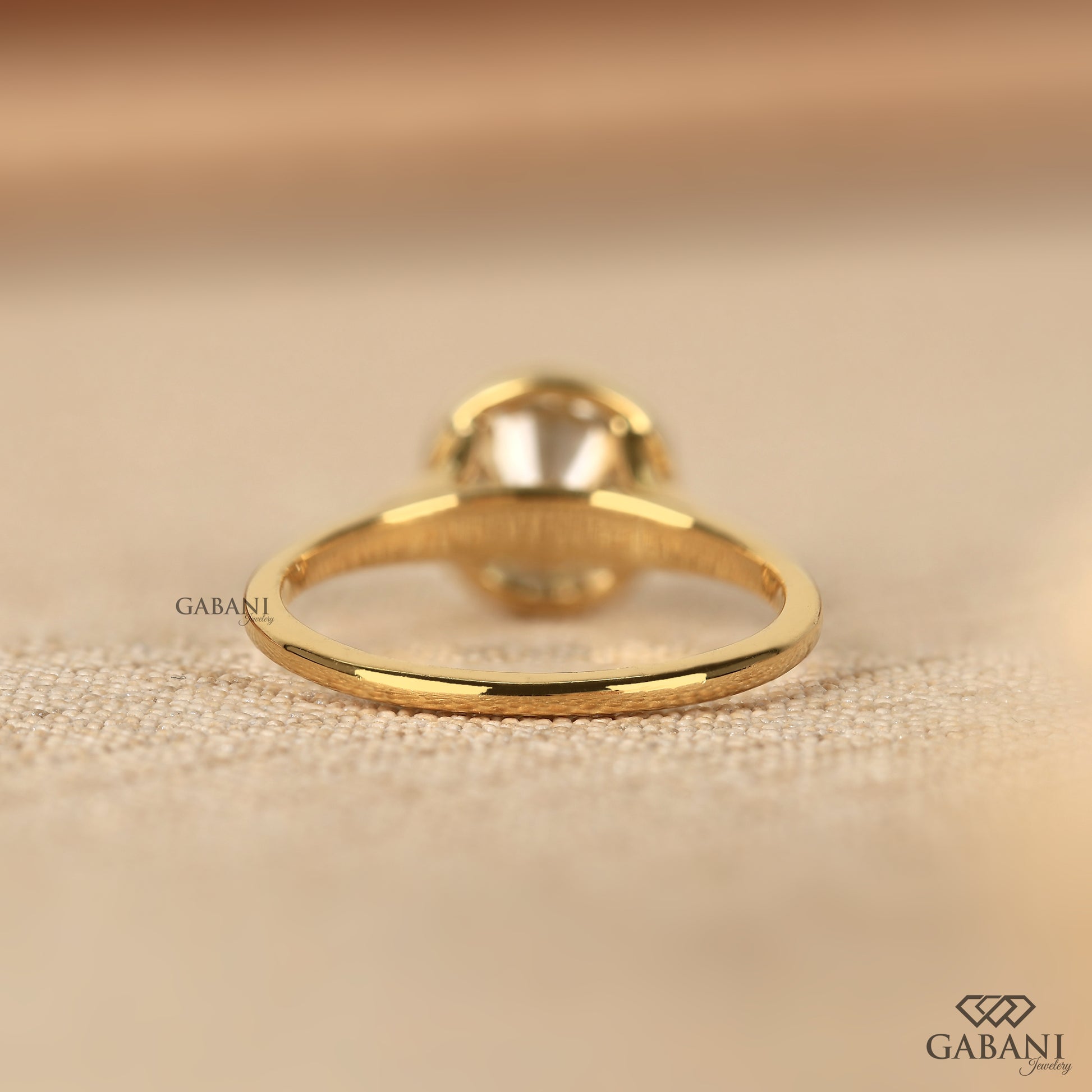 Classic round lab grown diamond solitaire ring in smooth yellow gold bezel