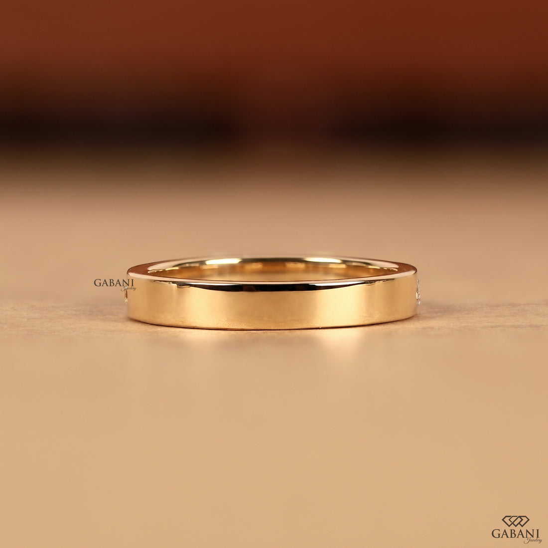 Multi shaped lab grown diamond band in solid 14K yellow gold with a flush setting designed as a stacking ring, wedding band, and anniversary ring.