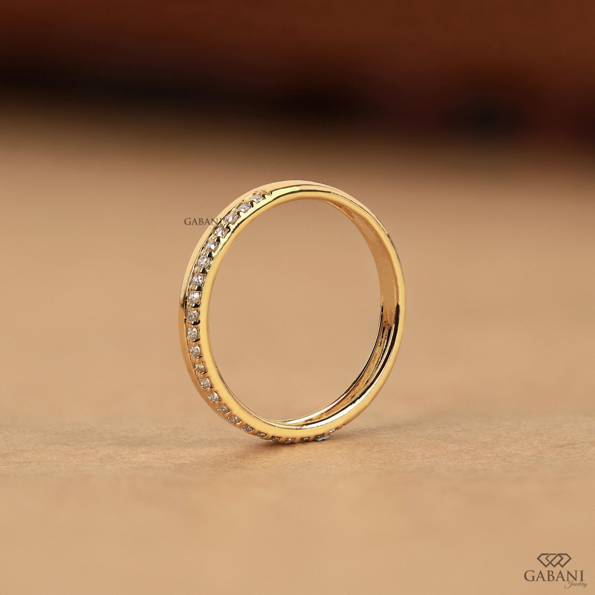 single row pave lab grown diamond band in gold flat stackable ring