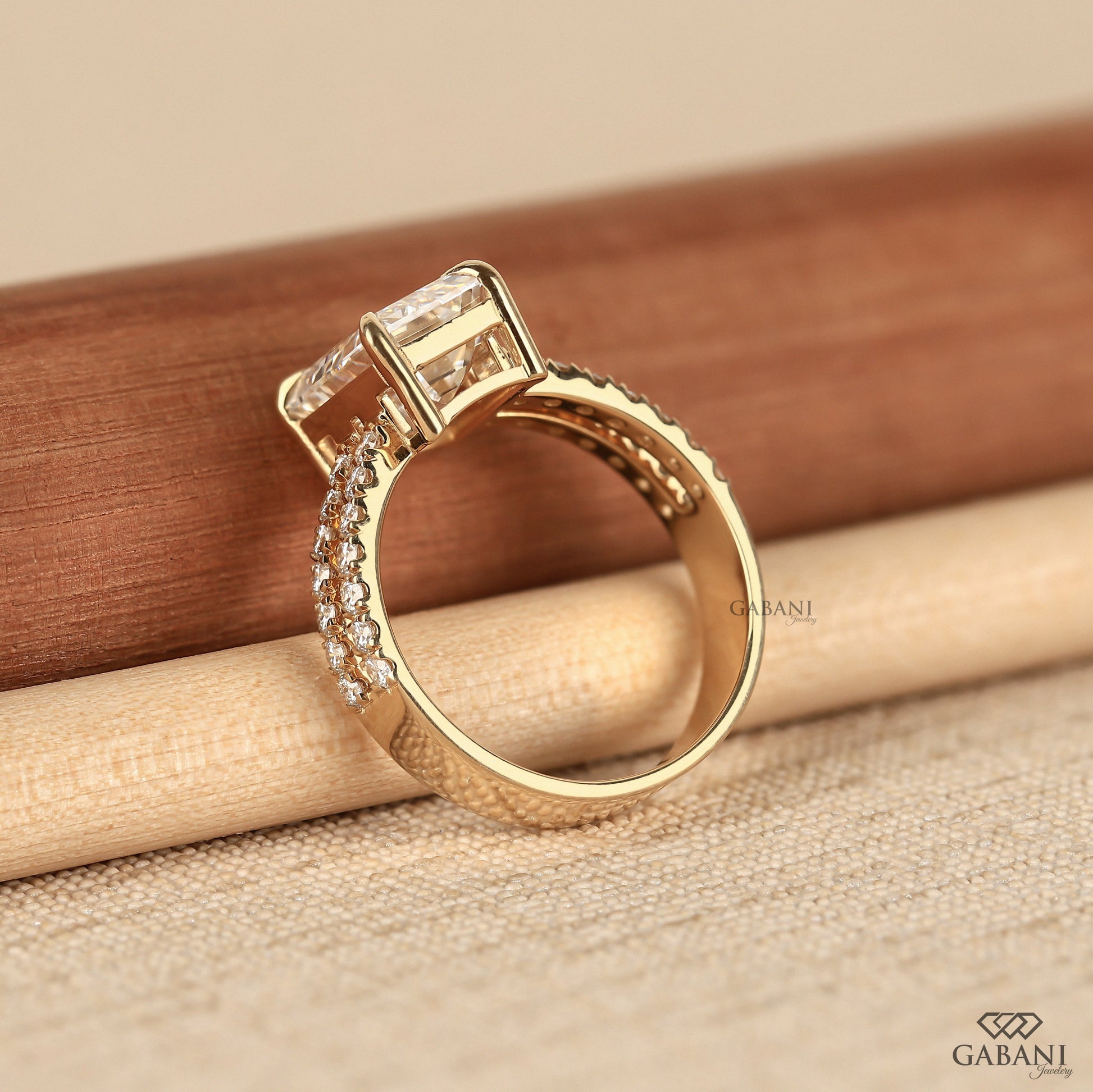 Lab grown emerald cut diamond ring with French pavé shank accents
