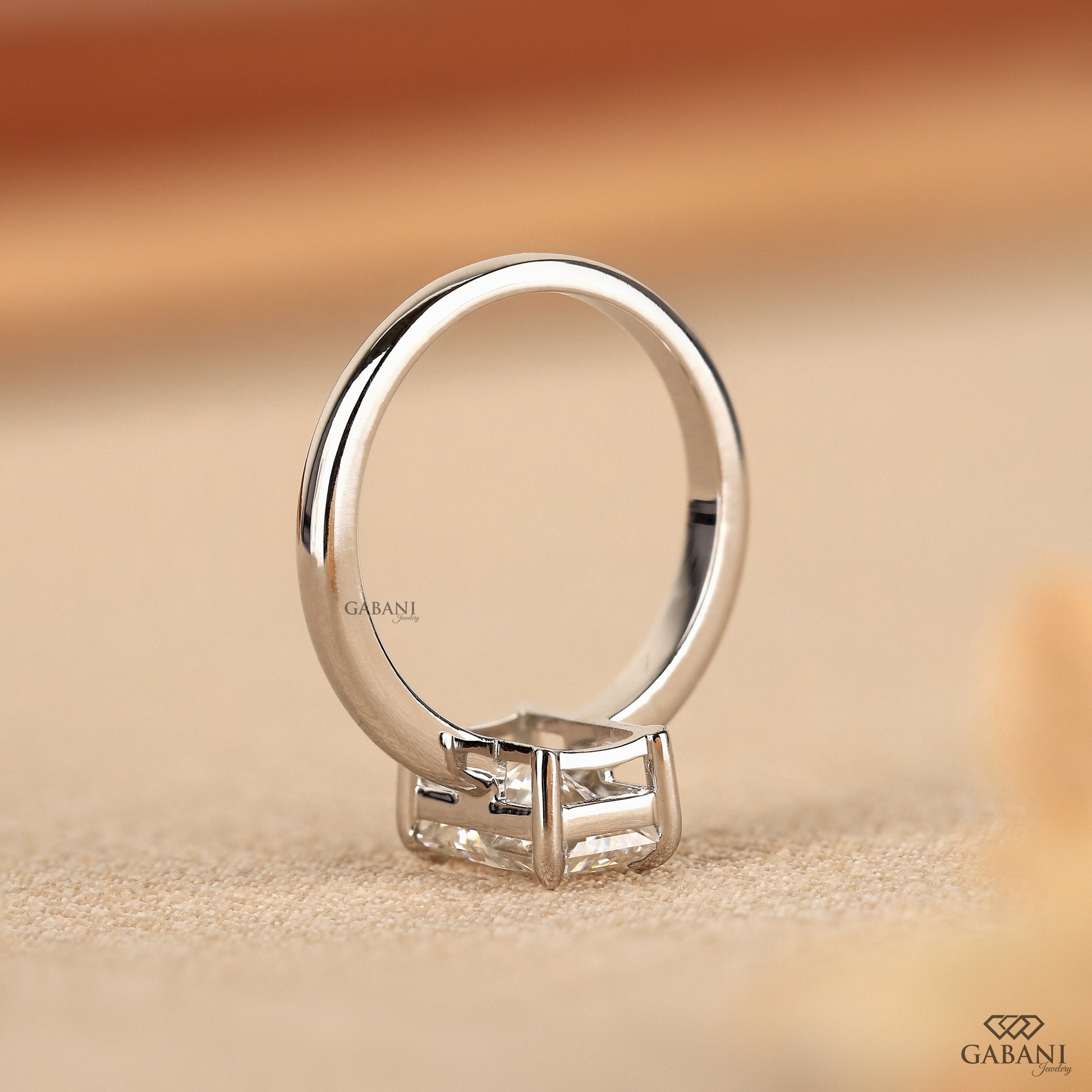 radiant cut lab grown diamond engagement ring with claw prongs and smooth white gold shank