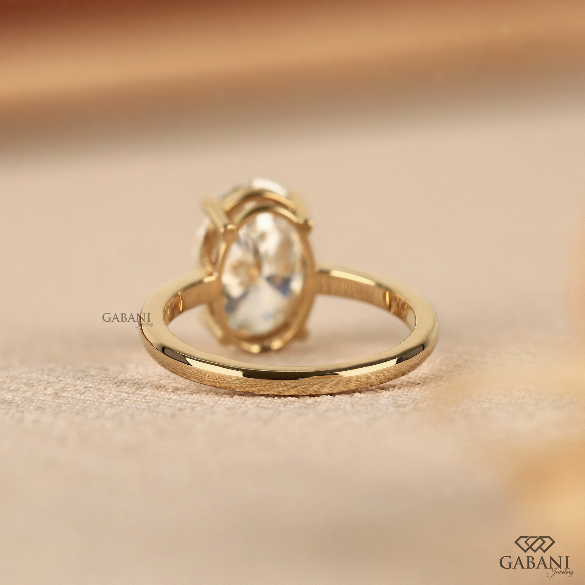 3 carat oval lab diamond ring with smooth gold band
