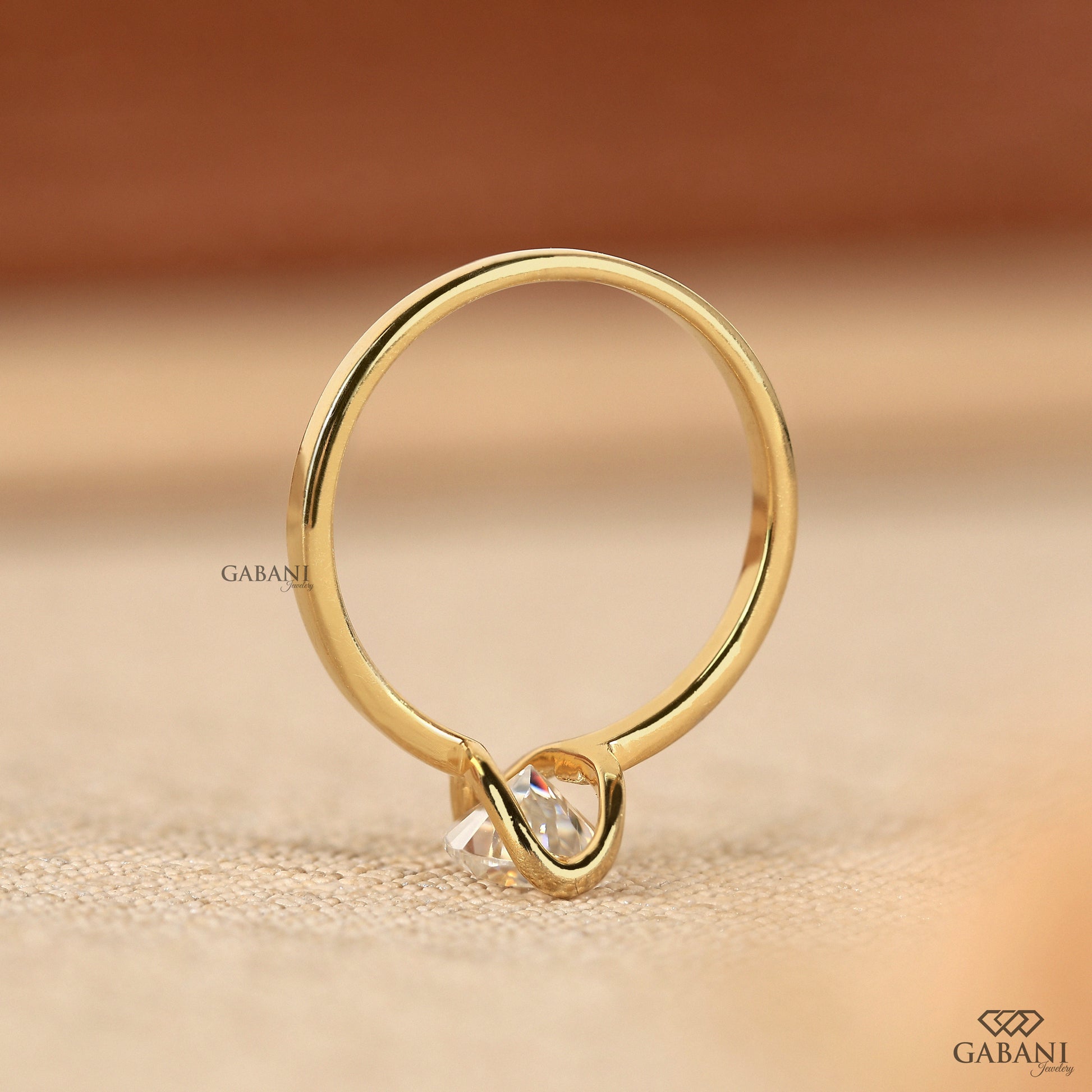 Minimal pear lab grown diamond solitaire ring in half bezel design
