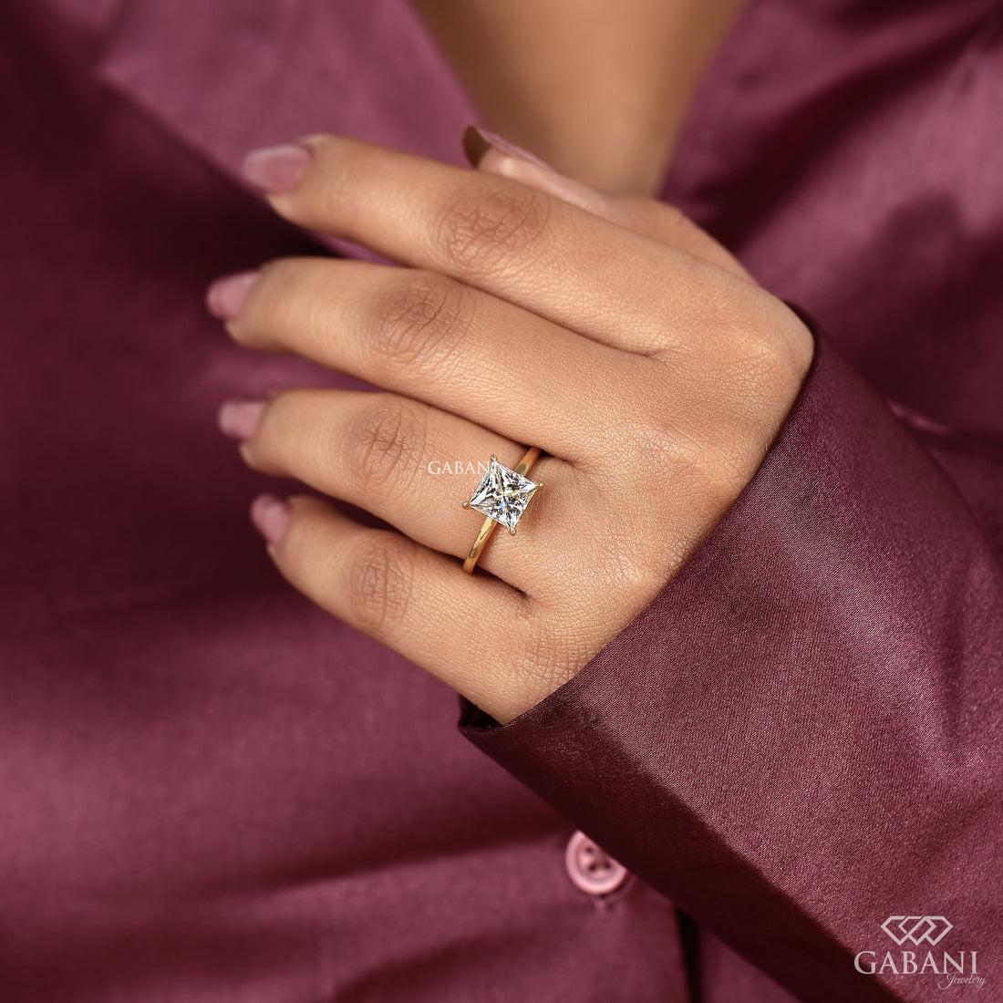 princess cut lab grown diamond solitaire engagement ring in 18K yellow gold with a classic four prong setting and polished band.