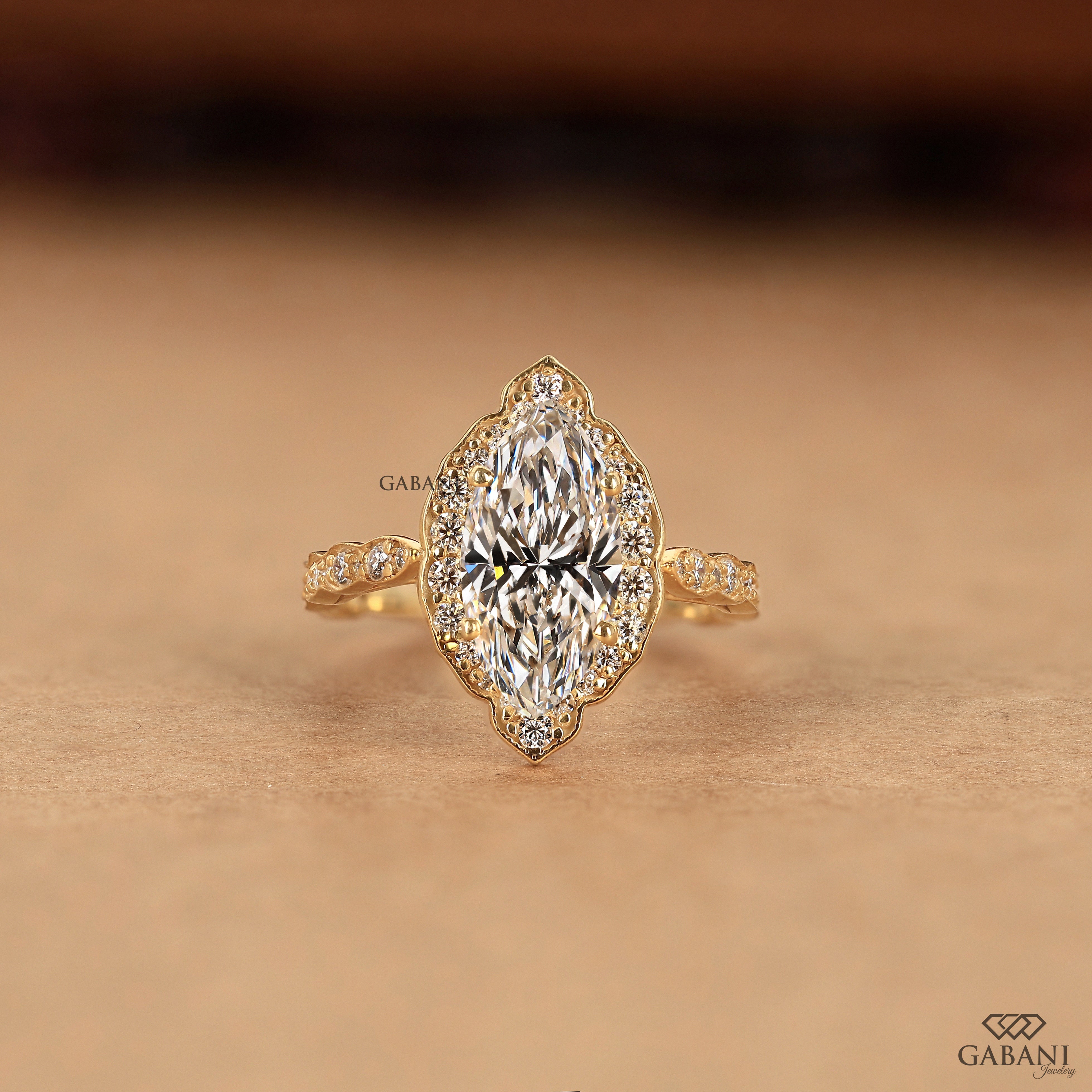 Marquise cut lab grown diamond halo engagement ring with pave band