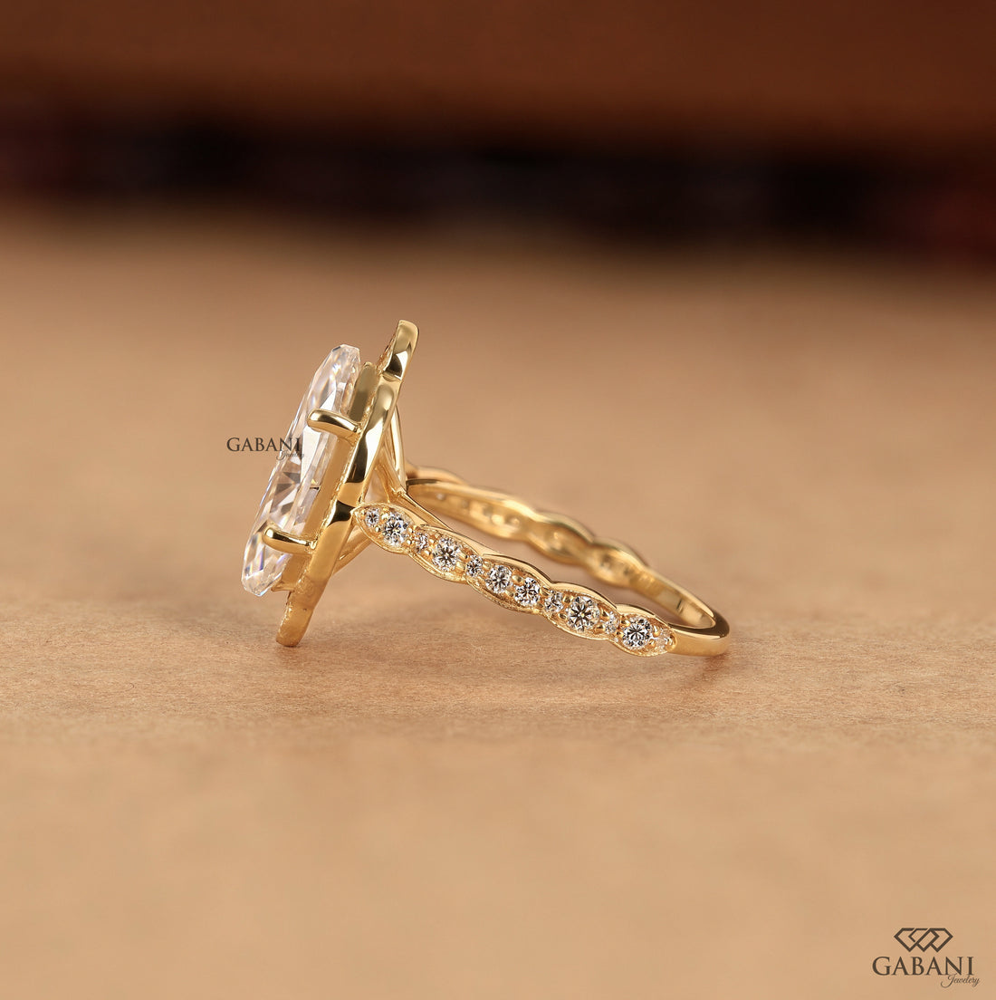 Lab grown diamond engagement ring with marquise center and pave halo