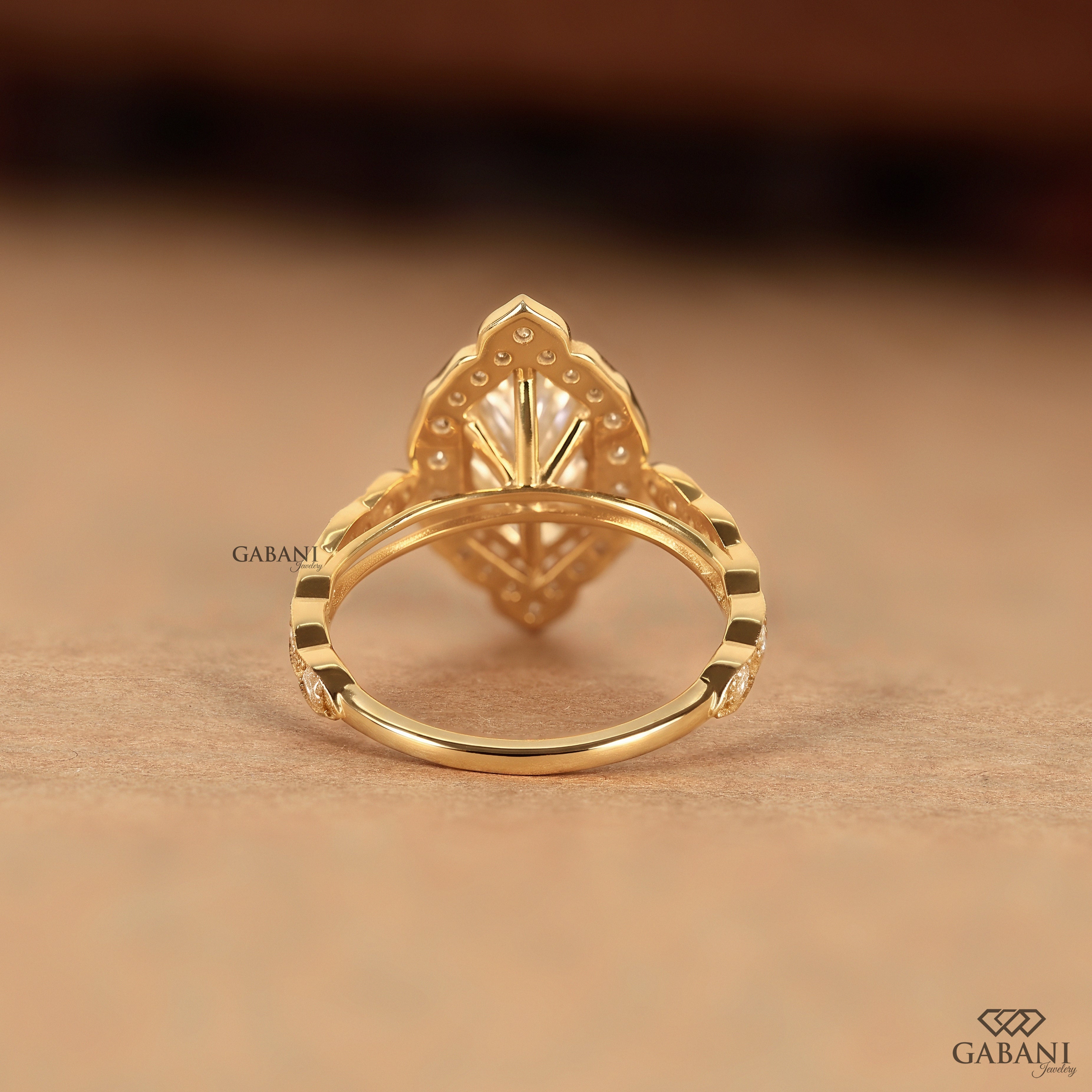 Marquise diamond ring with lab grown center stone and pave band