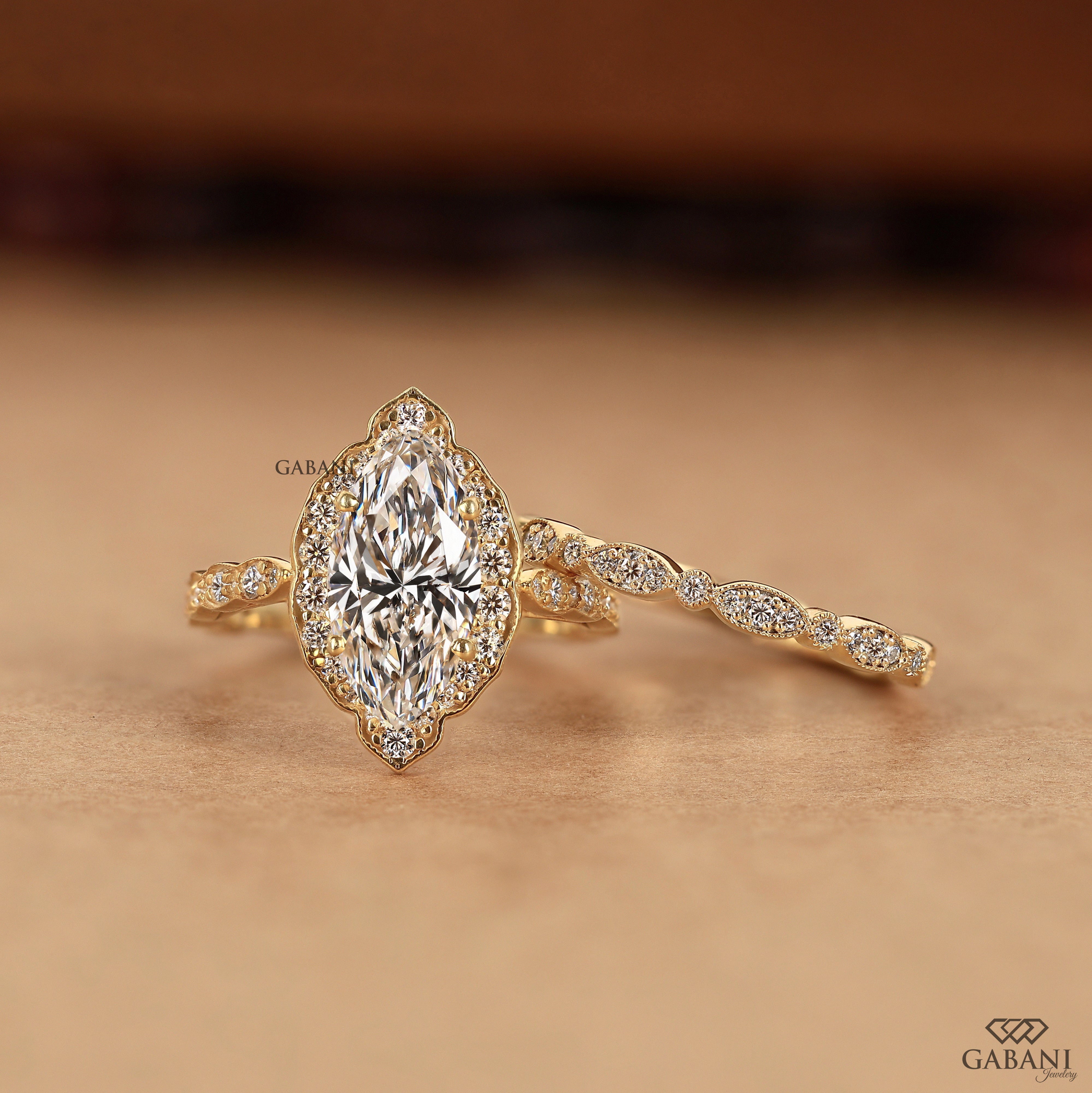 Marquise cut engagement ring with lab grown diamond and halo accents