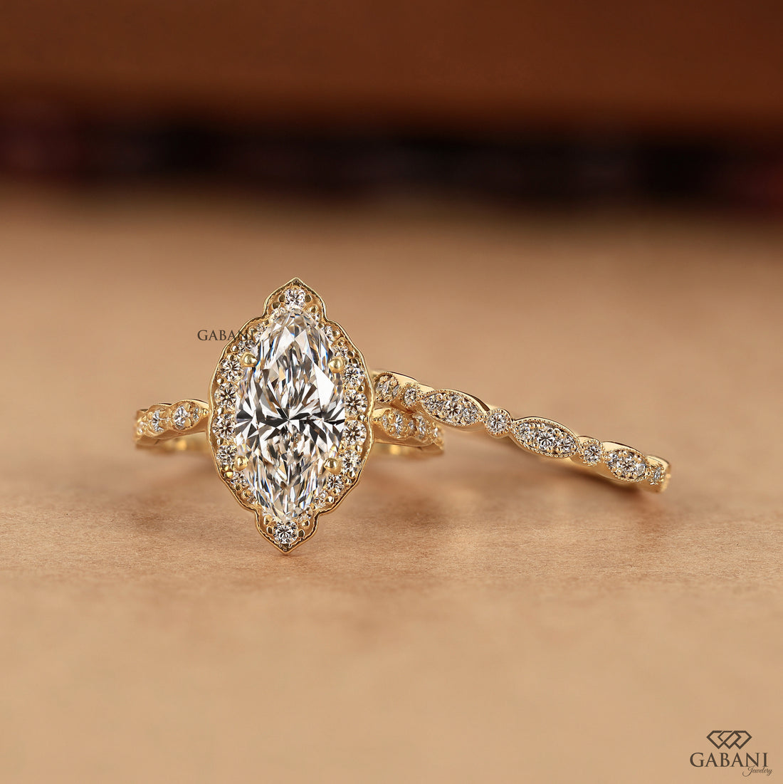 Marquise cut engagement ring with lab grown diamond and halo accents