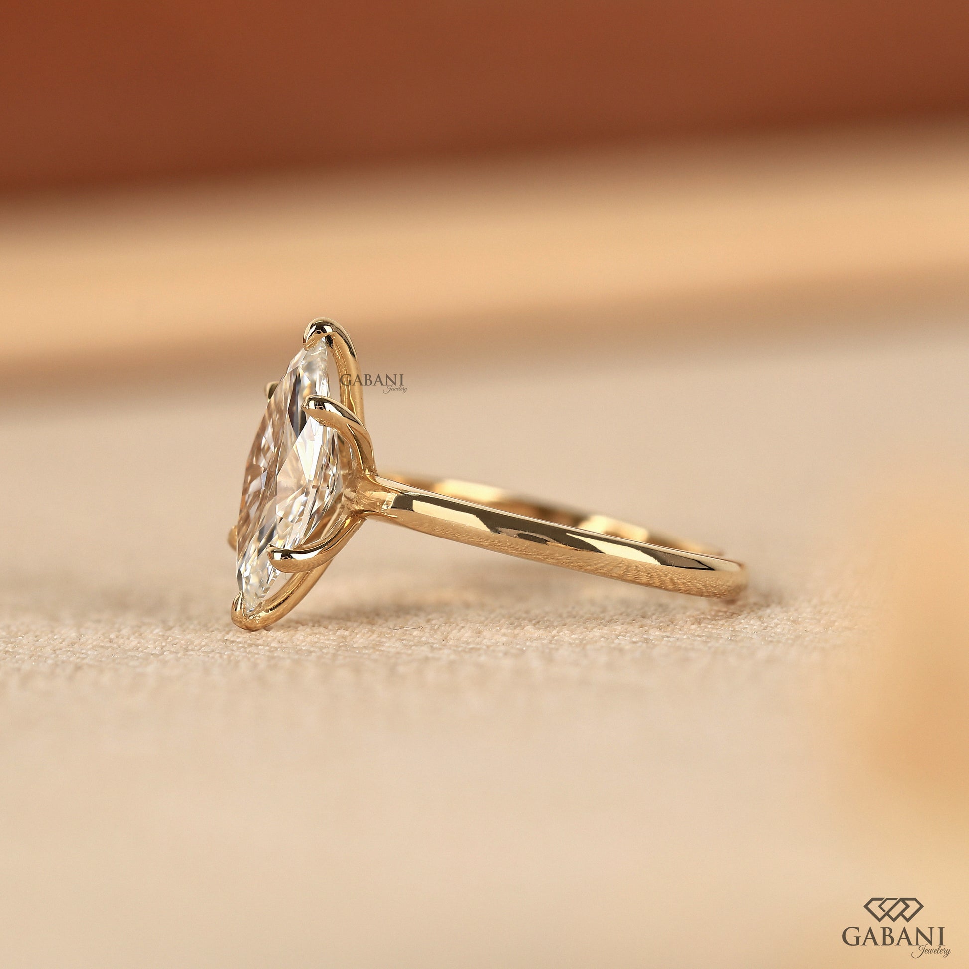 2 carat marquise lab diamond solitaire in polished yellow gold
