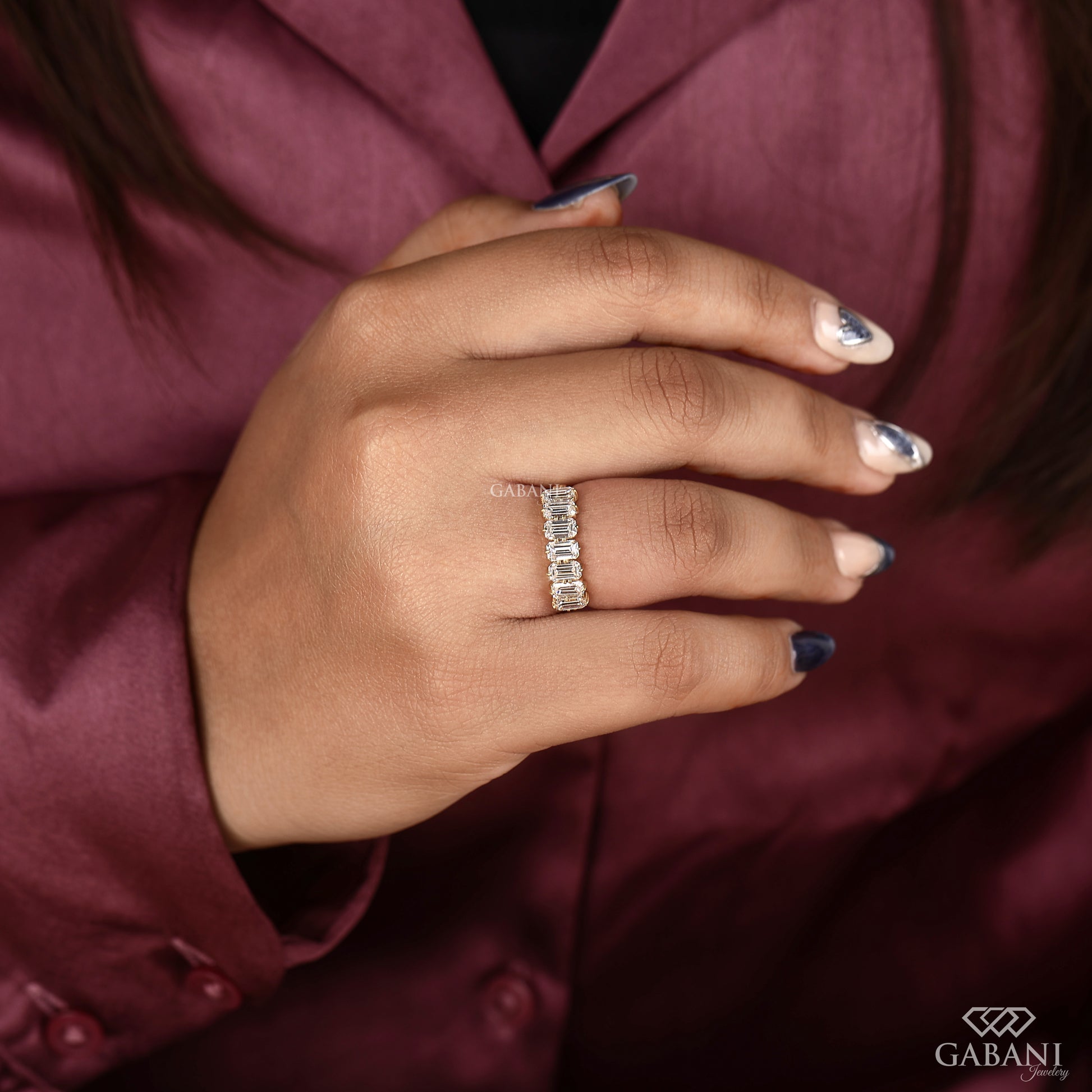 Half eternity seven stone ring with emerald cut lab grown diamonds and comfort fit yellow gold band