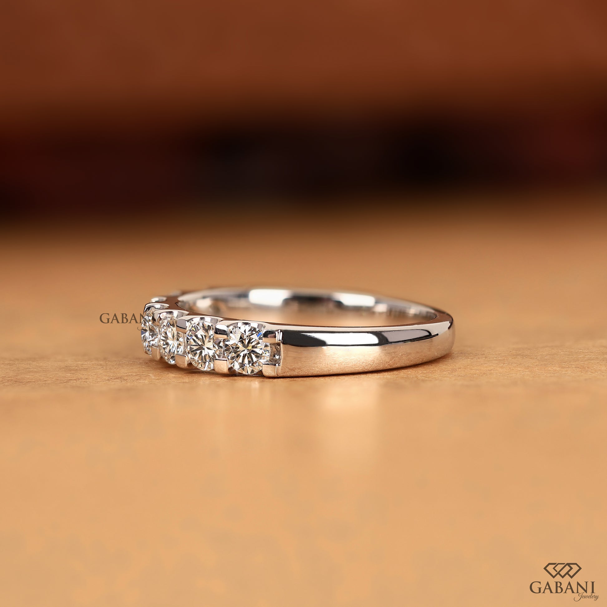 7 stone round lab grown diamond band in shiny white gold French pavé comfort fit design