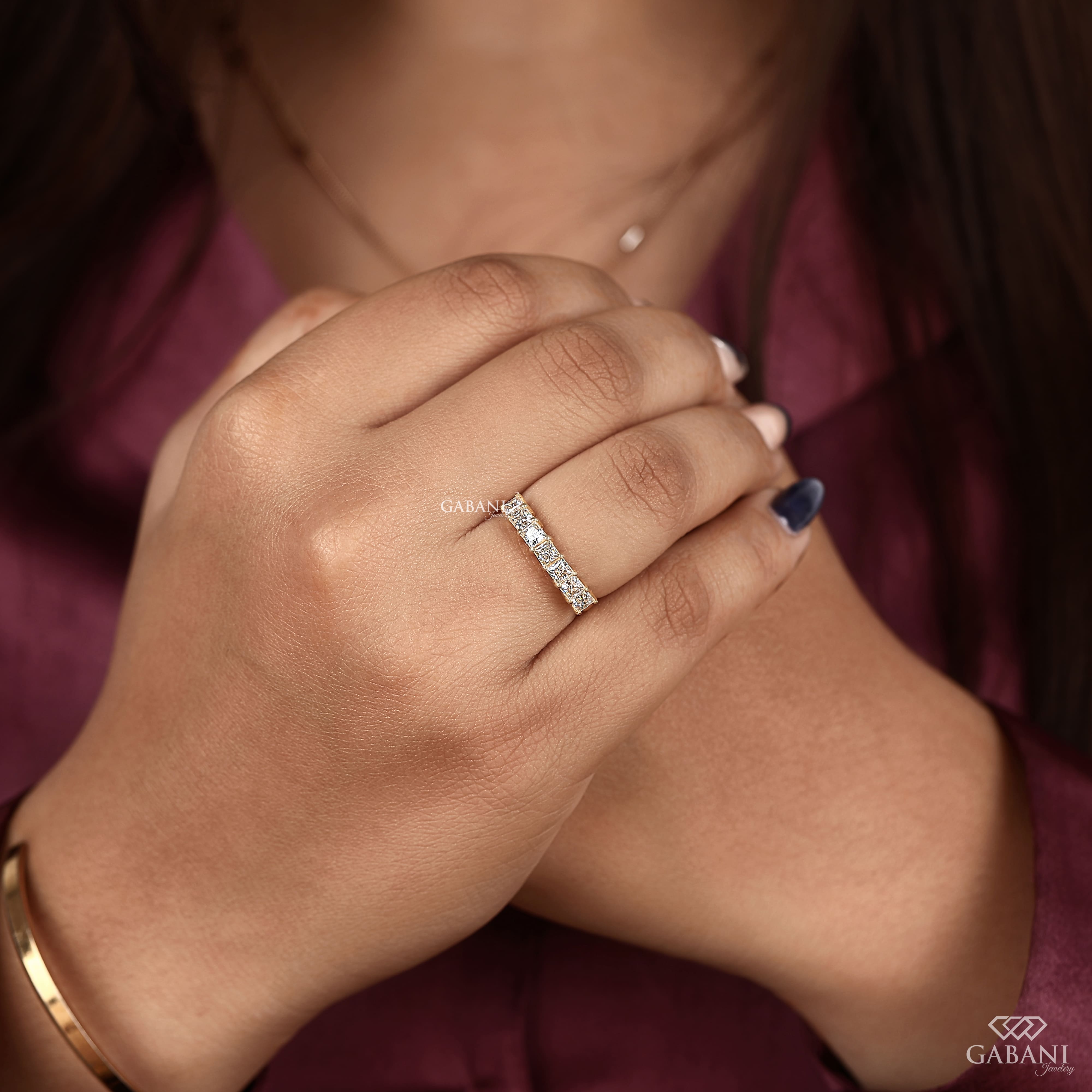 seven stone princess cut lab grown diamond wedding band in 14K yellow gold. A classic half eternity ring for weddings, anniversaries and stacking.