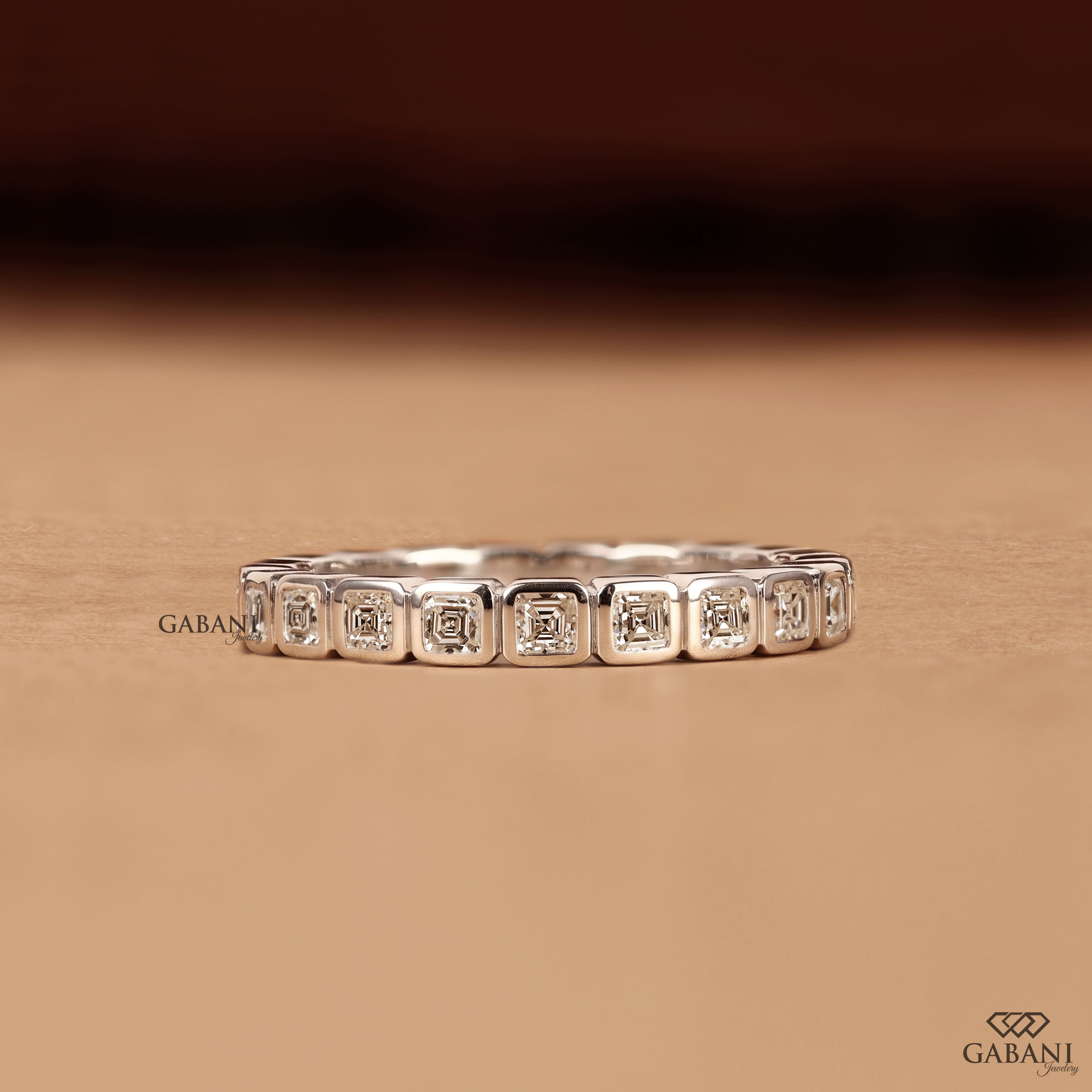 Asscher cut lab grown diamond full eternity band in white gold with bezel set EF color VS1 clarity diamonds, designed as a wedding, anniversary, bridal, or stackable ring.
