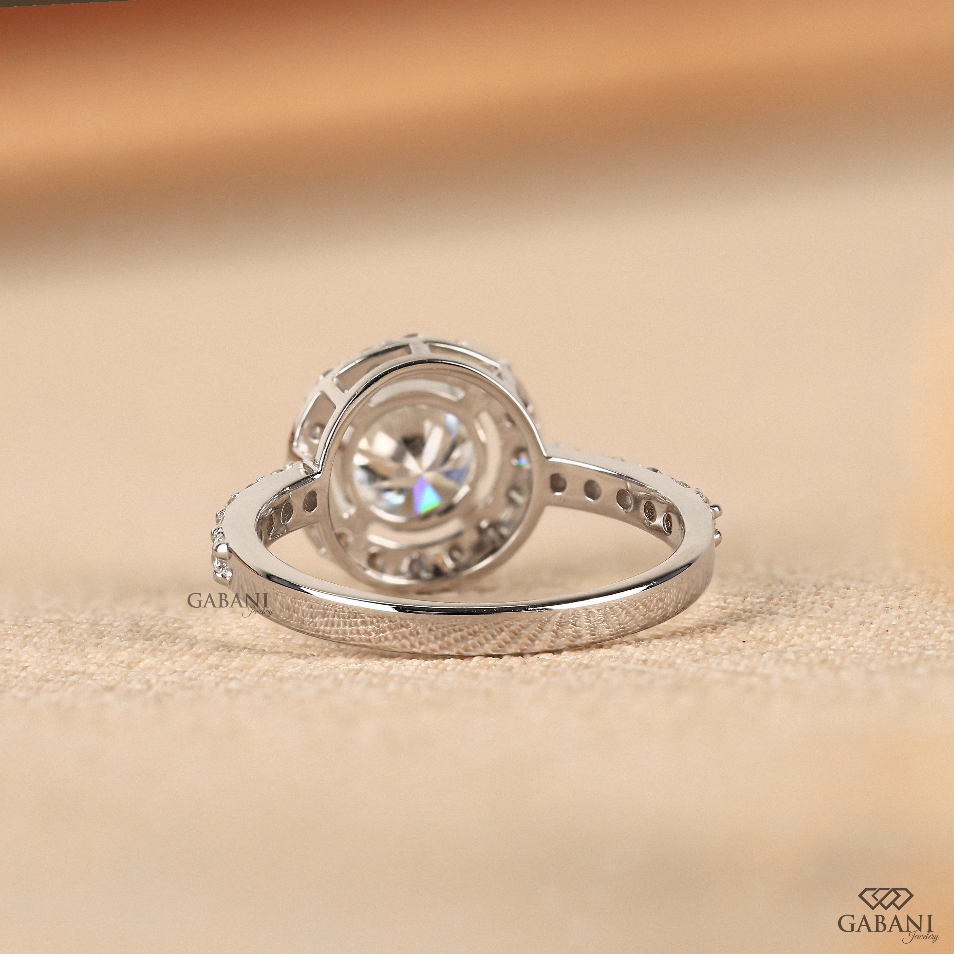 Round cut lab grown diamond halo engagement ring with pave diamond band, yellow gold setting, IGI certified EF color VS1 clarity.