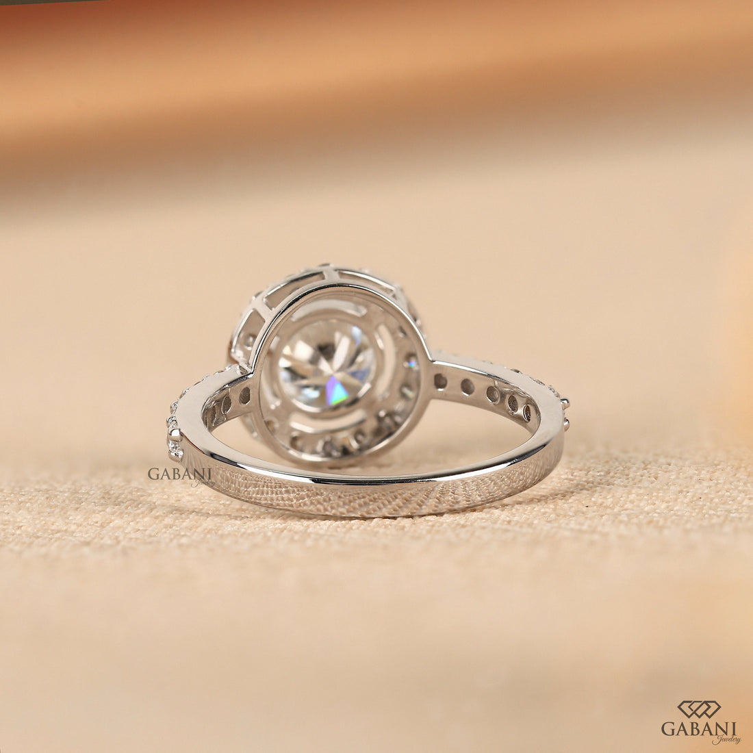 Round cut lab grown diamond halo engagement ring with pave diamond band, yellow gold setting, IGI certified EF color VS1 clarity.