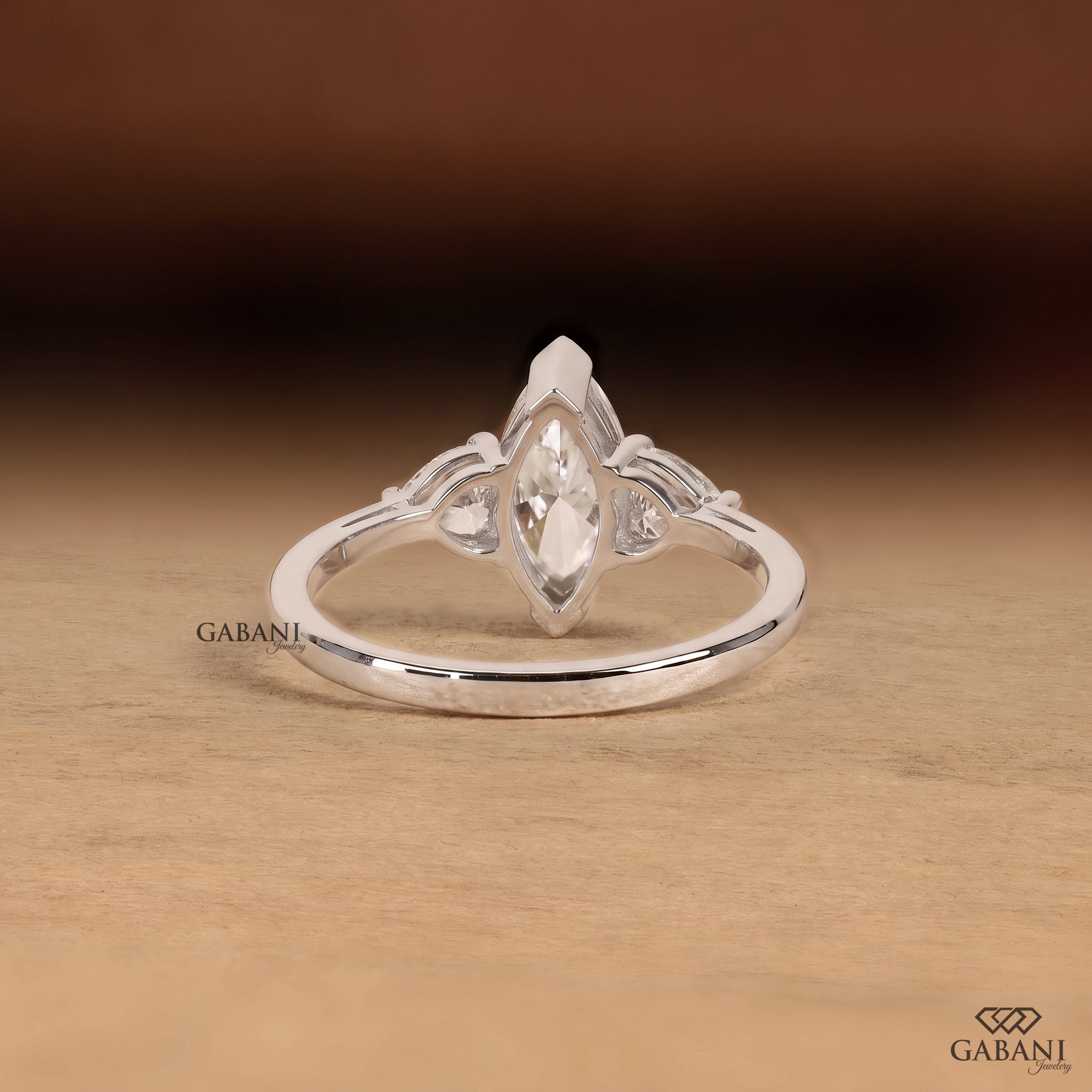 Marquise cut lab grown diamond engagement ring with heart shaped side stones