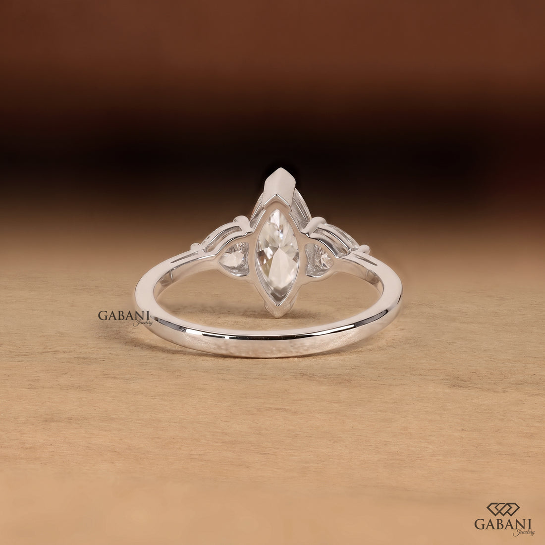 Marquise cut lab grown diamond engagement ring with heart shaped side stones
