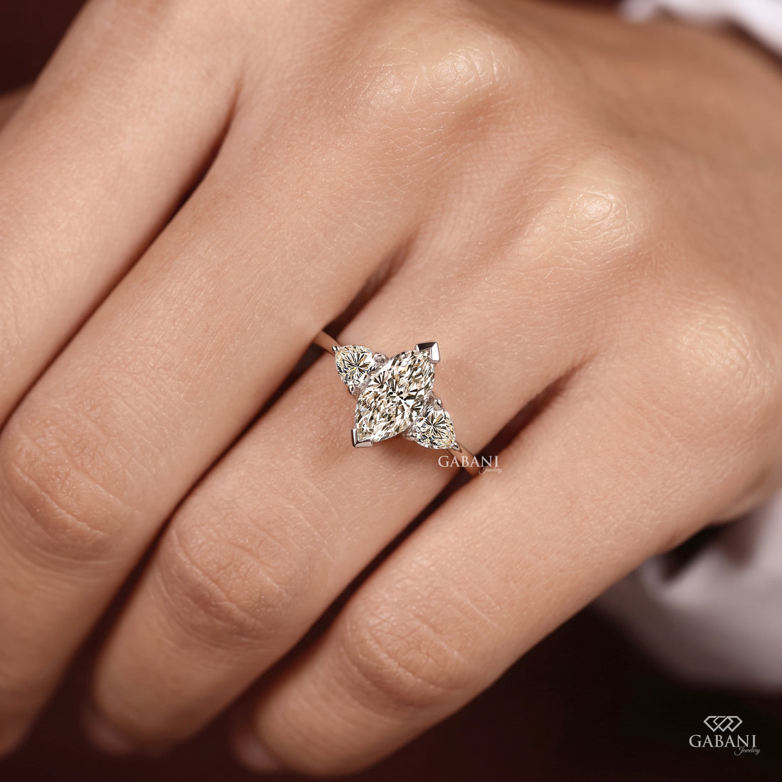Marquise cut lab grown diamond engagement ring with heart shaped side stones