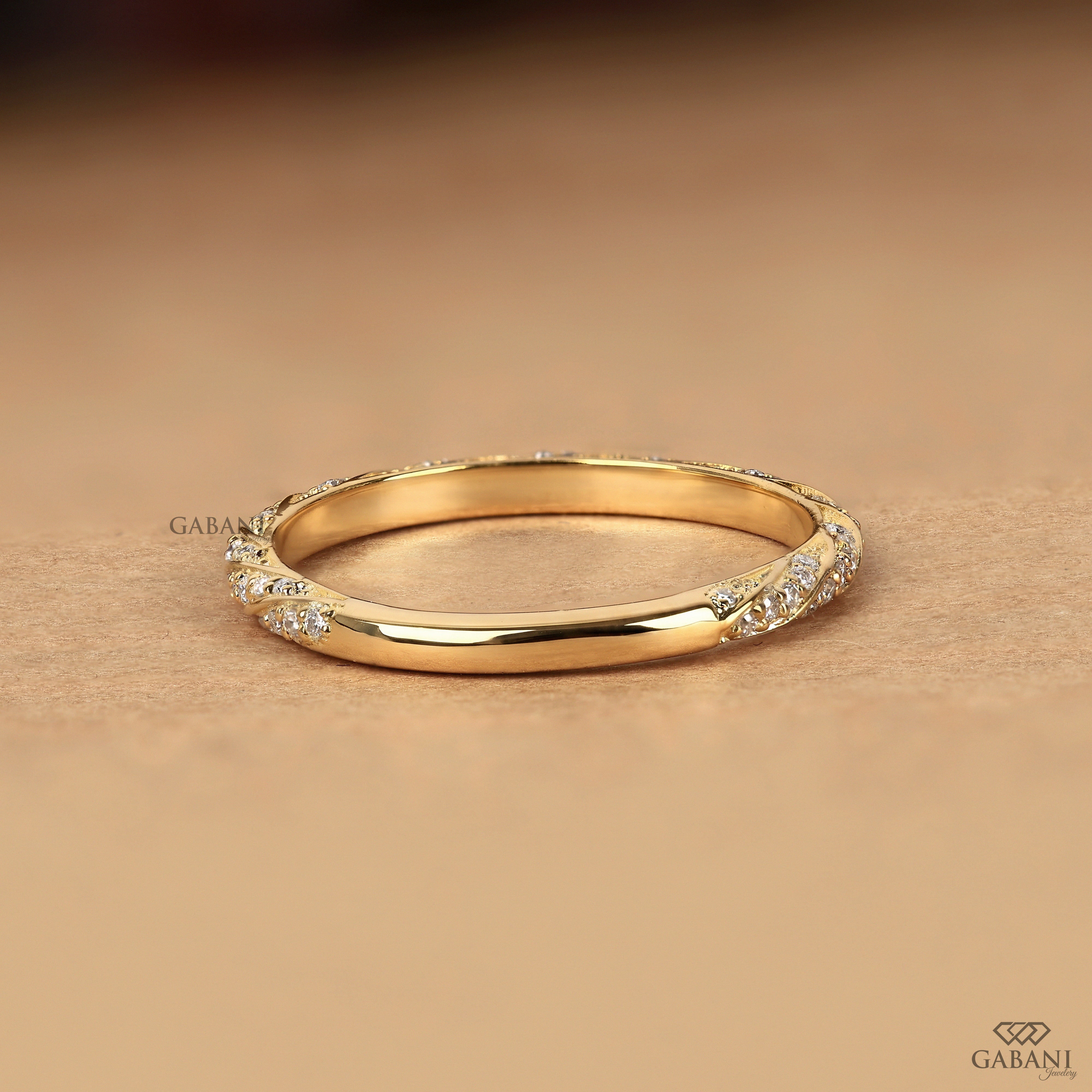 round diamond accents and fine milgrain edges, ideal for bridal stacking and anniversaries.