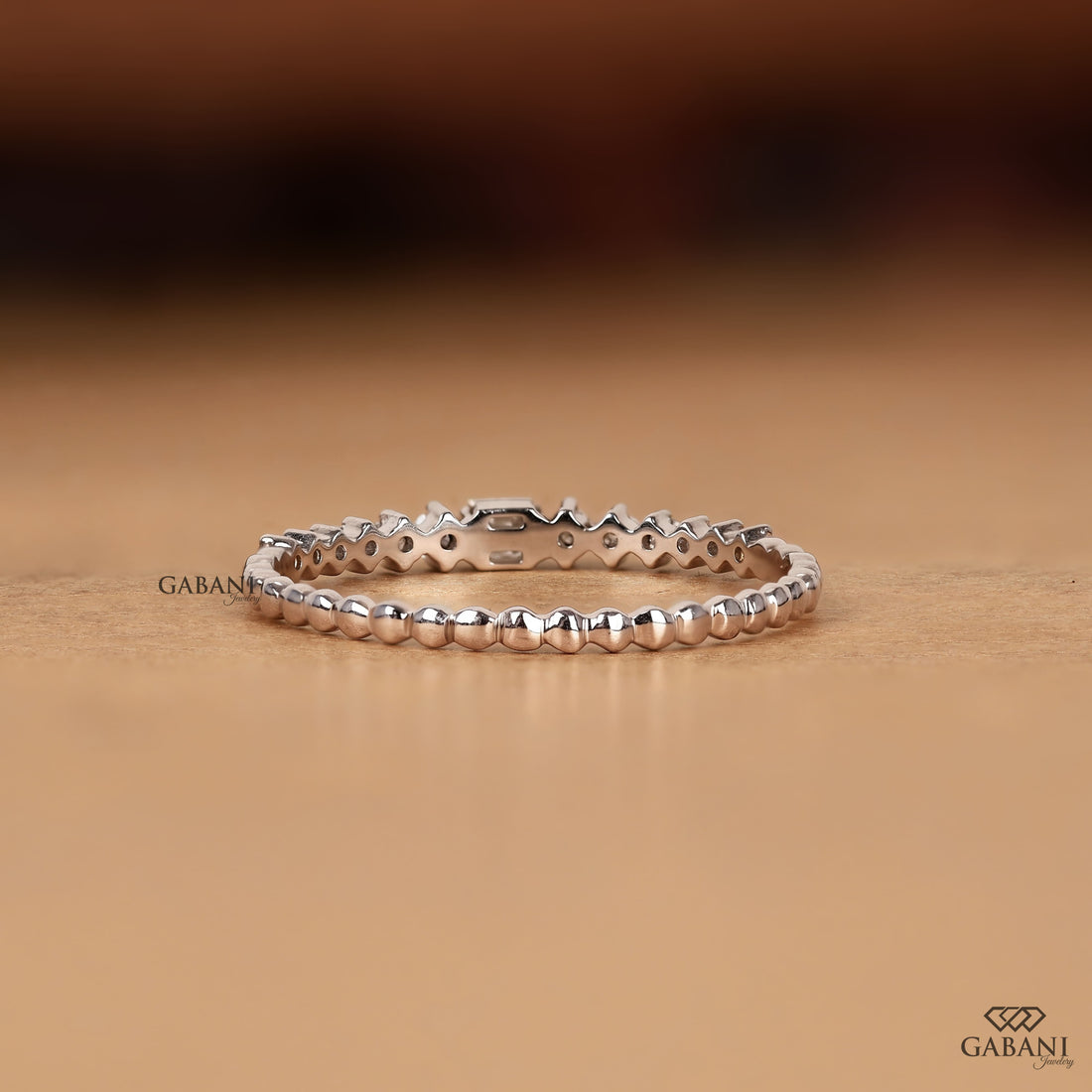Princess cut and round lab grown diamond wedding band in white gold with graduated prong set diamond design.