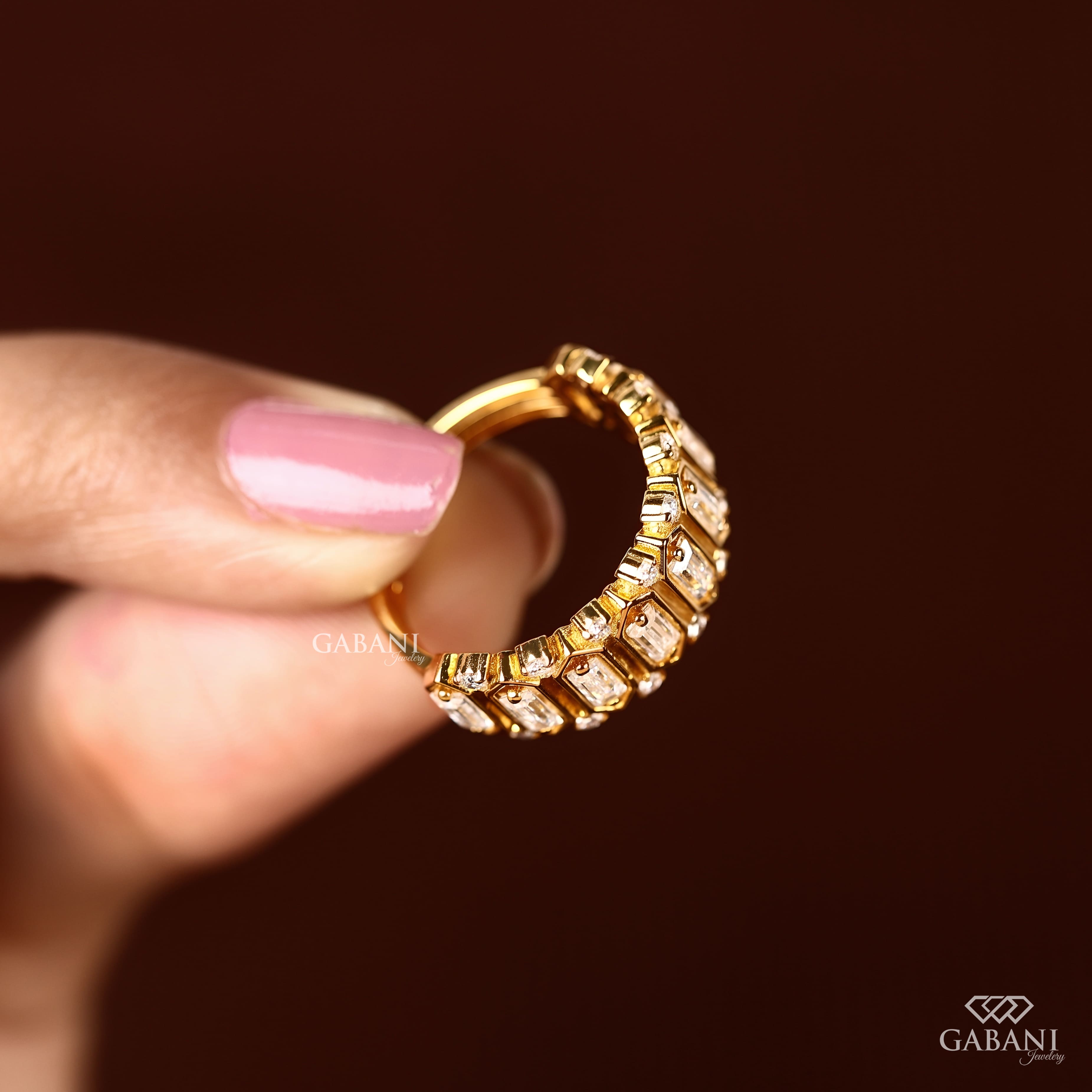 Emerald cut lab grown diamond wedding band in yellow gold with round diamond accents and a bold geometric design for bridal, anniversary, and statement wear.