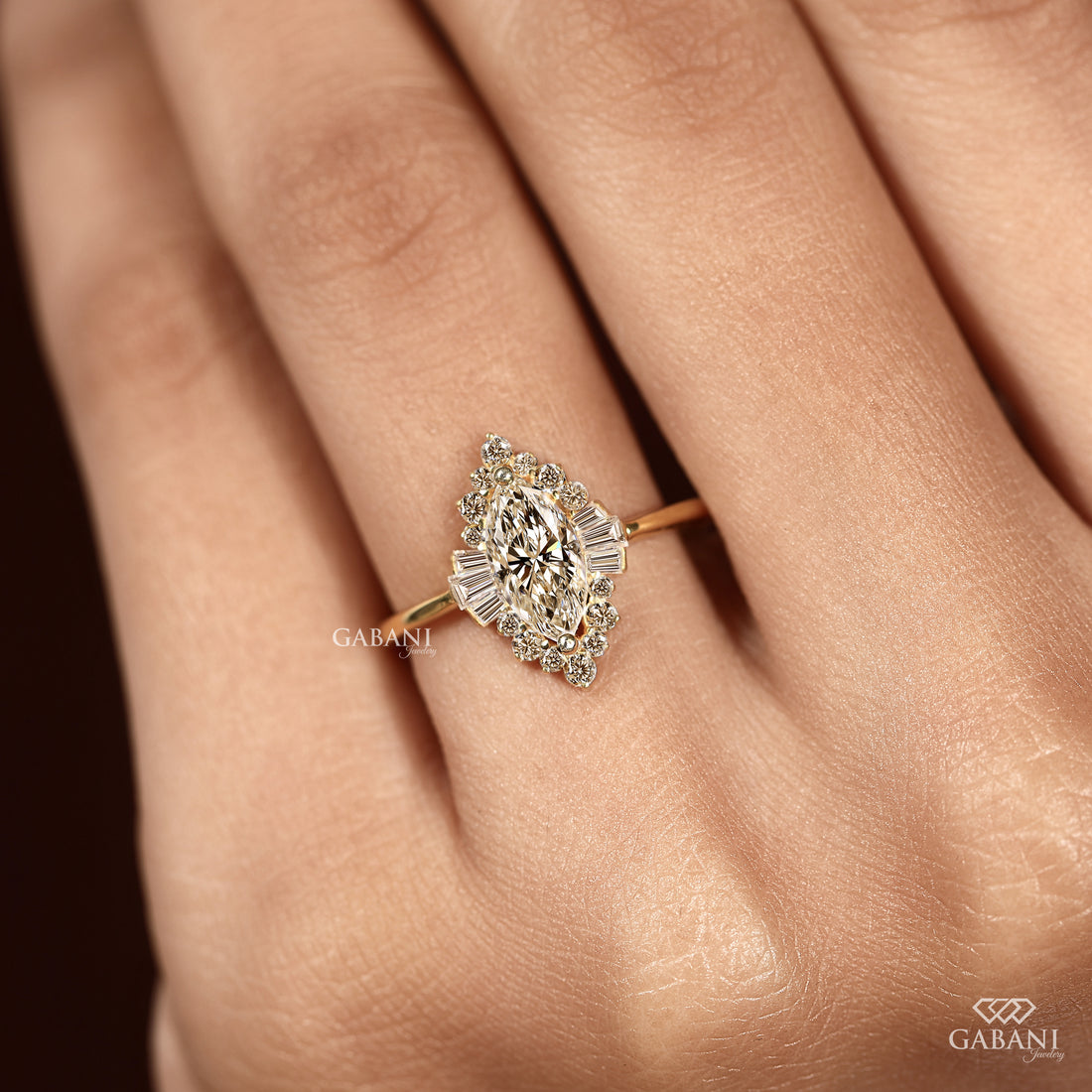 Marquise lab grown diamond engagement ring with floral halo, baguette side stones and yellow gold band, IGI certified EF color VS1 clarity.