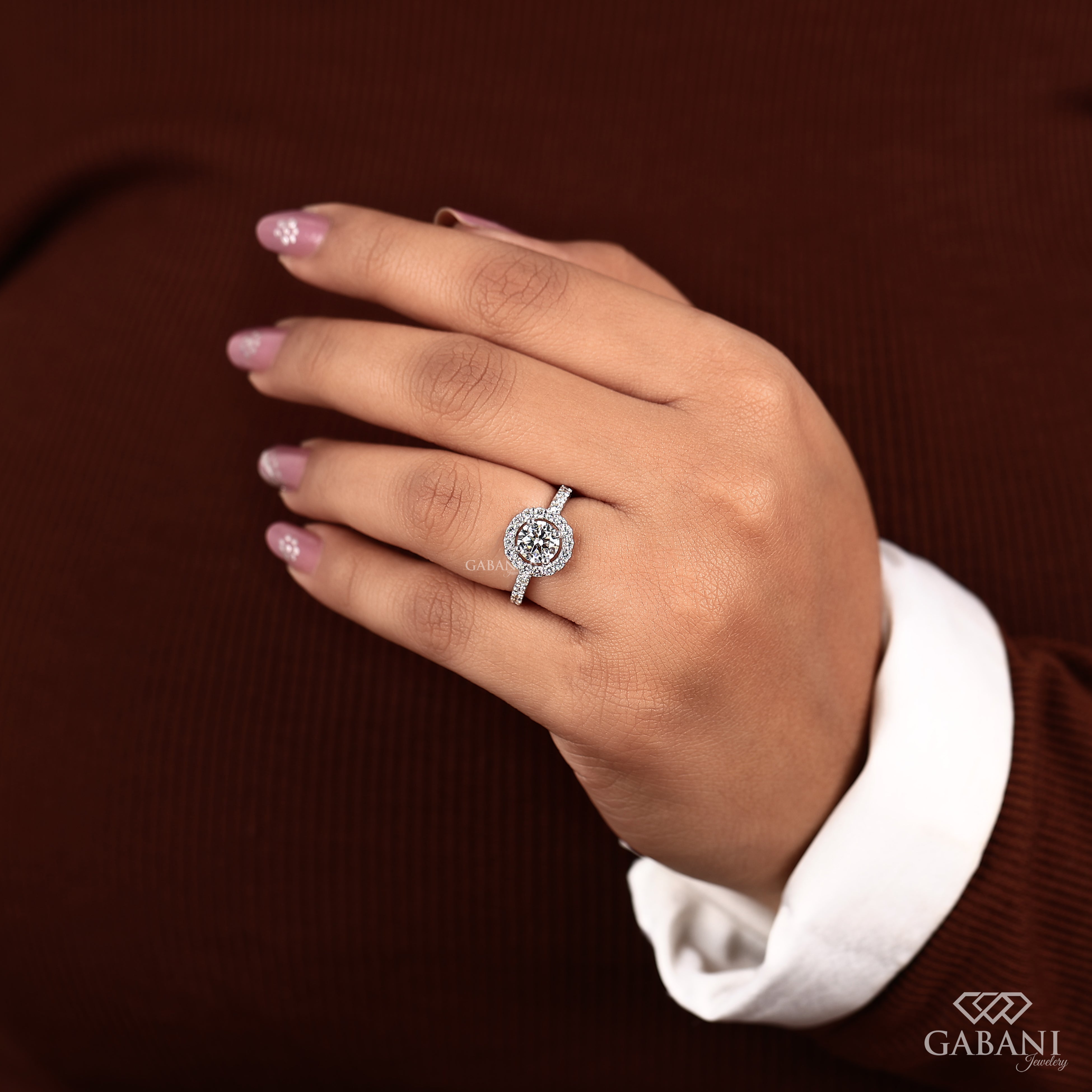 Round cut lab grown diamond halo engagement ring with pave diamond band, yellow gold setting, IGI certified EF color VS1 clarity.
