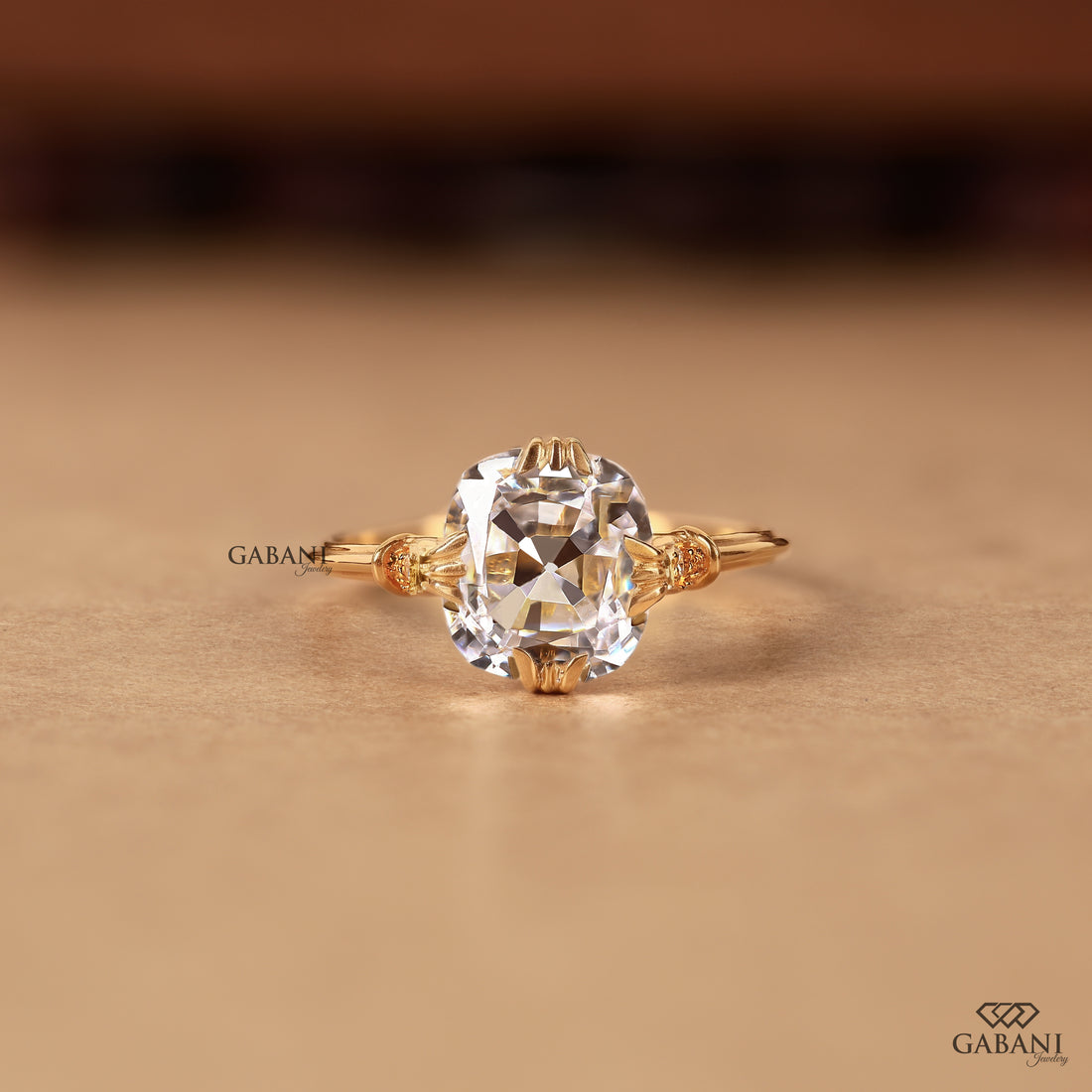 Cushion lab grown diamond ring with ornate shoulder details