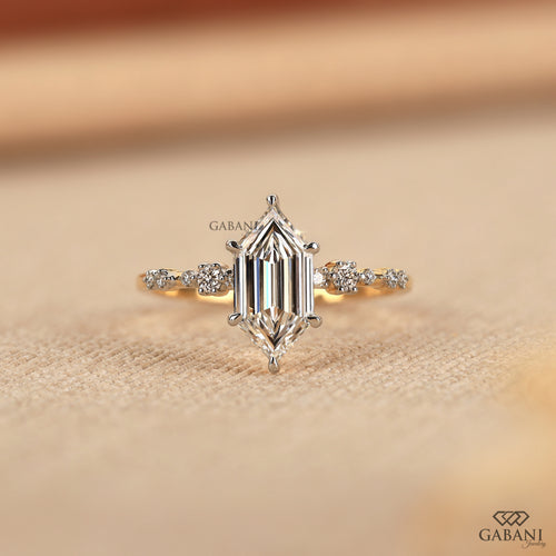 Dutch marquise lab grown diamond engagement ring with elongated geometric center stone, round side diamond accents and gold band.
