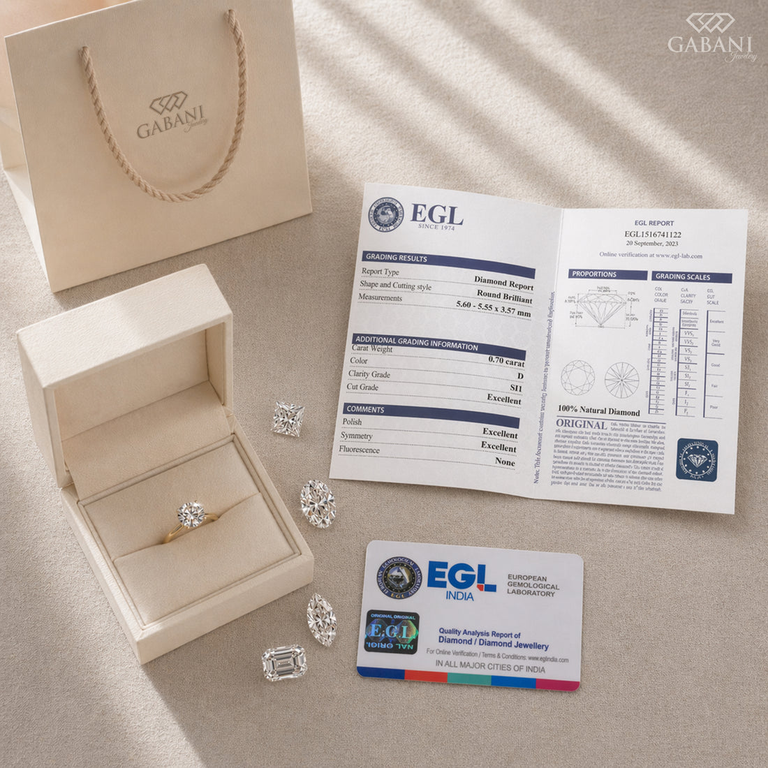 Diamonds in a box with an EGL report and card on a beige surface, featuring Gabani branding.
