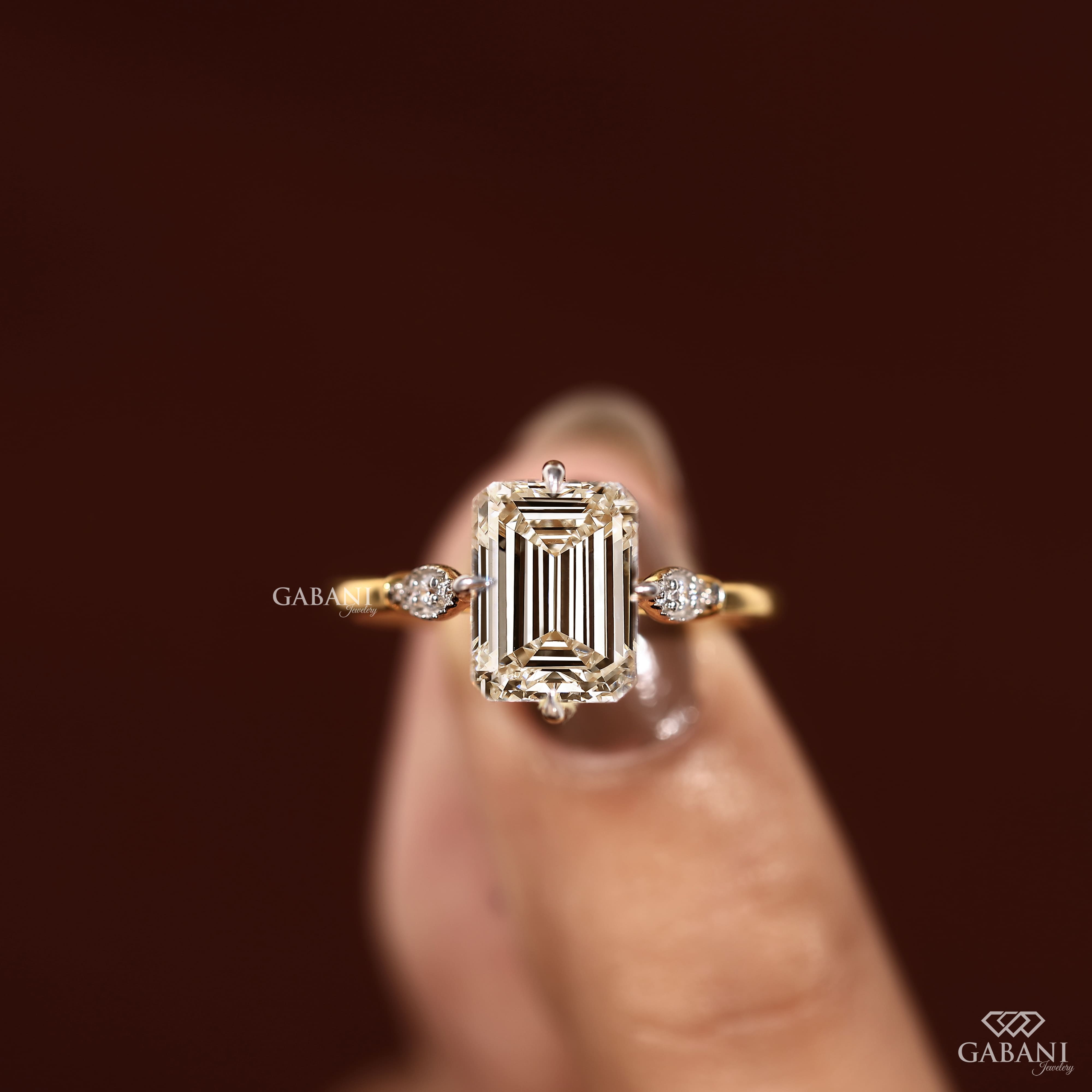 Emerald cut lab grown diamond engagement ring with 9x7mm center stone