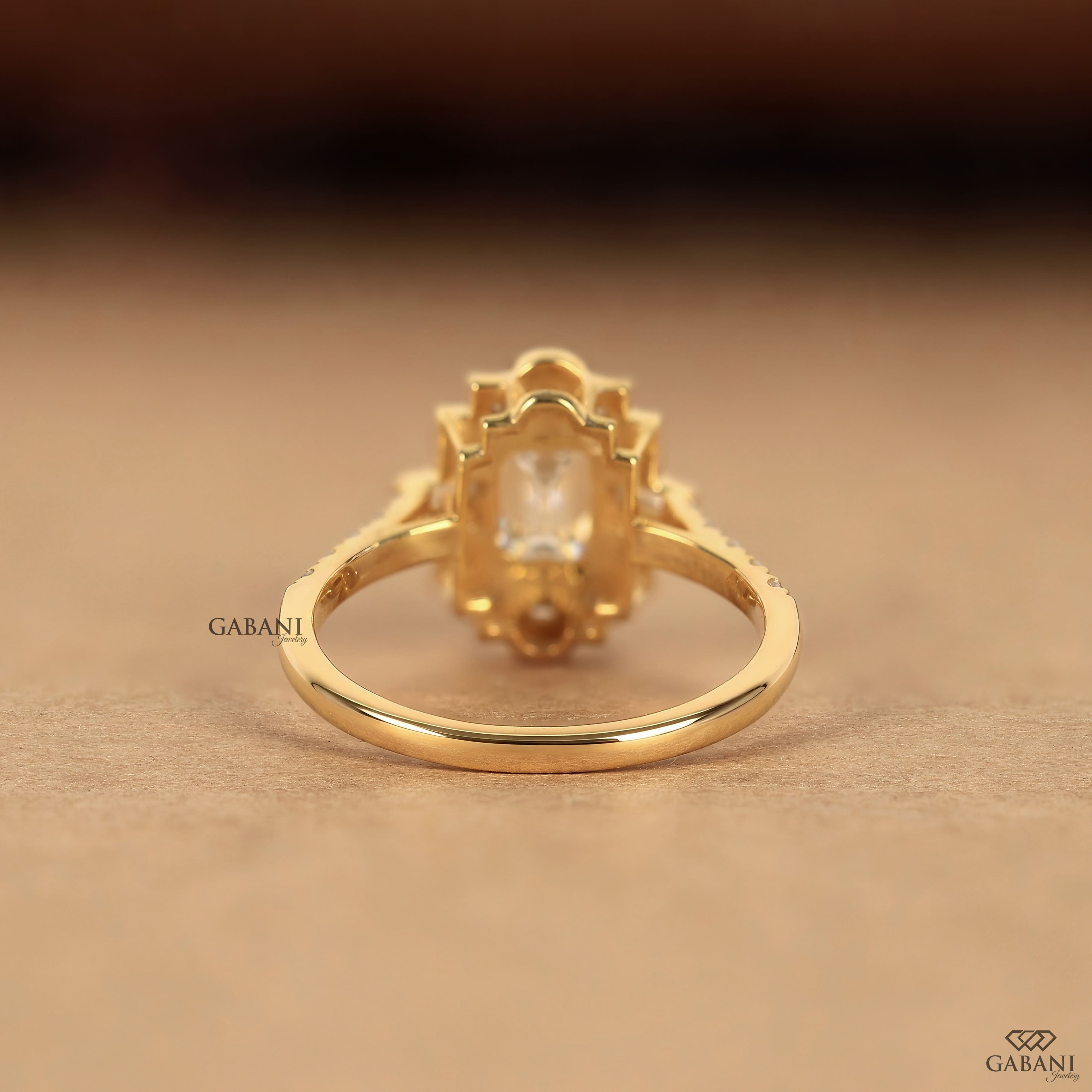Emerald cut lab grown diamond Art Deco engagement ring with baguette and round diamond accents in gold setting