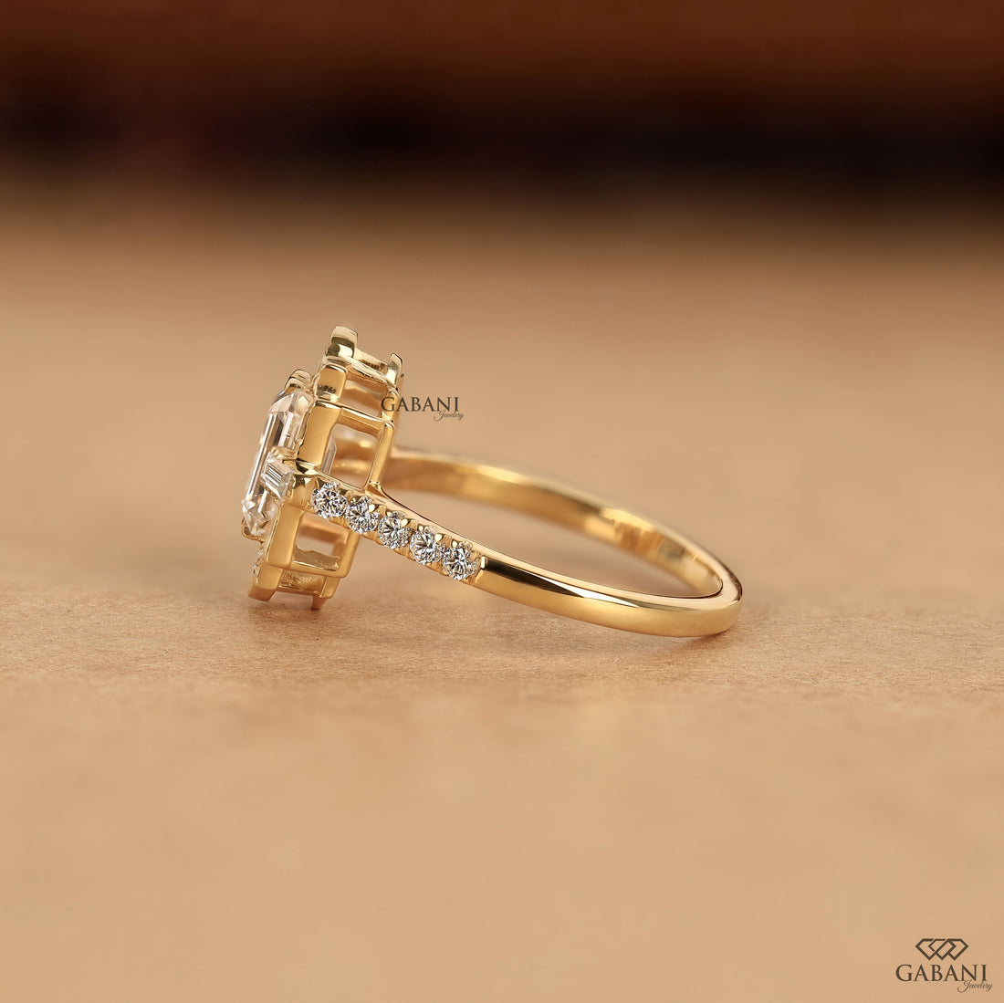 Emerald cut lab grown diamond Art Deco engagement ring with baguette and round diamond accents in gold setting