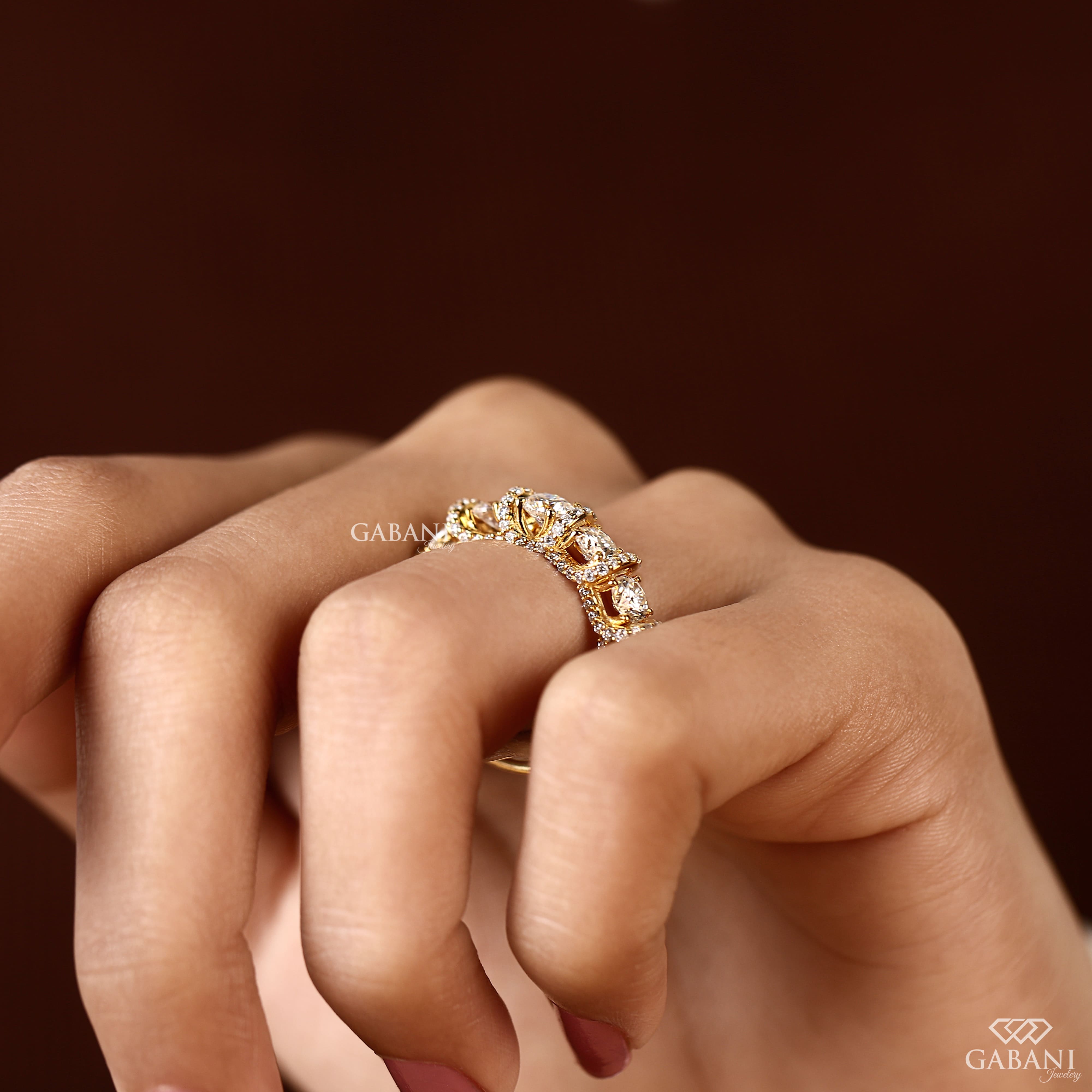 Five stone round cut lab grown diamond wedding band in yellow gold with diamond accent setting, designed for bridal, anniversary and stackable wear.