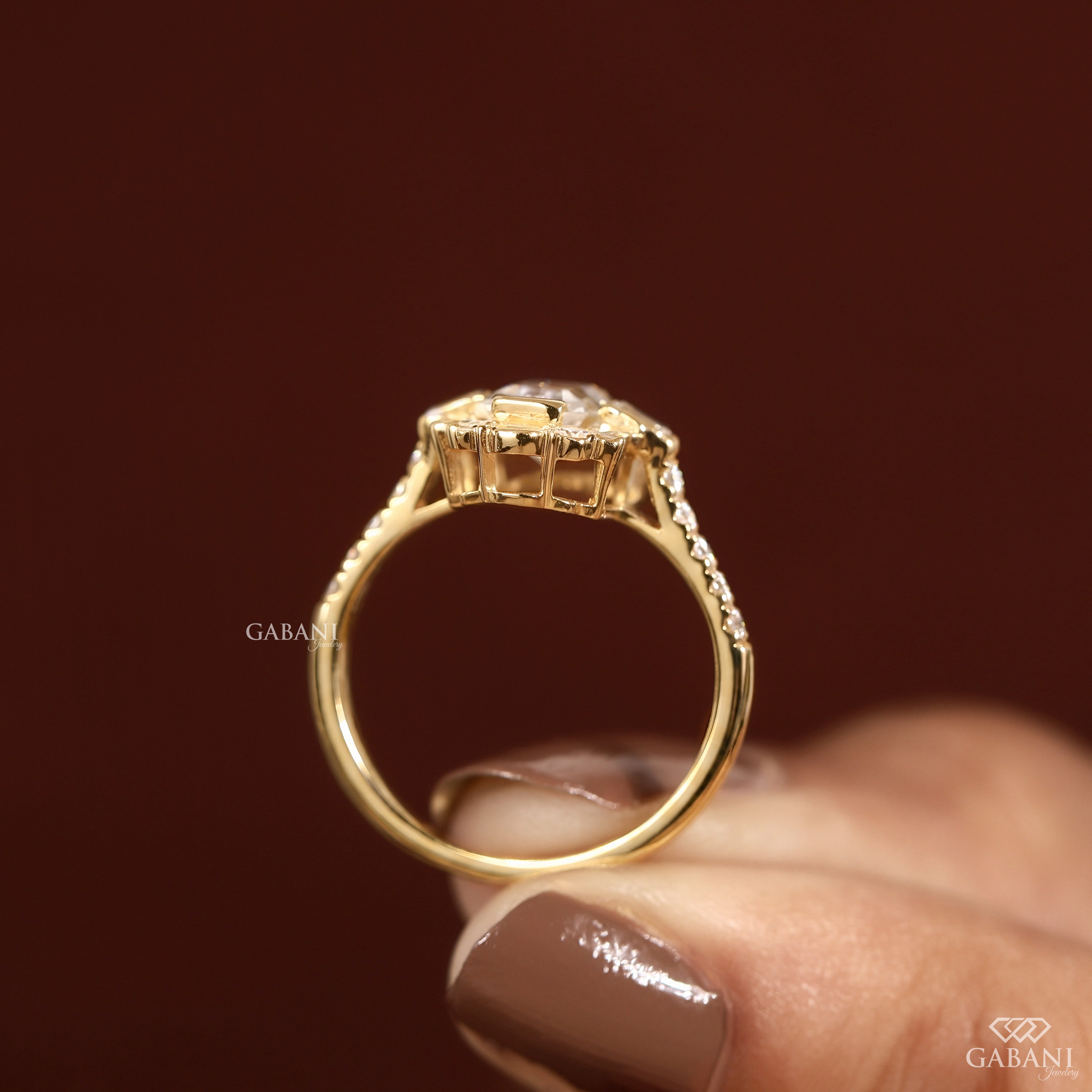 Emerald cut lab grown diamond Art Deco engagement ring with baguette and round diamond accents in gold setting
