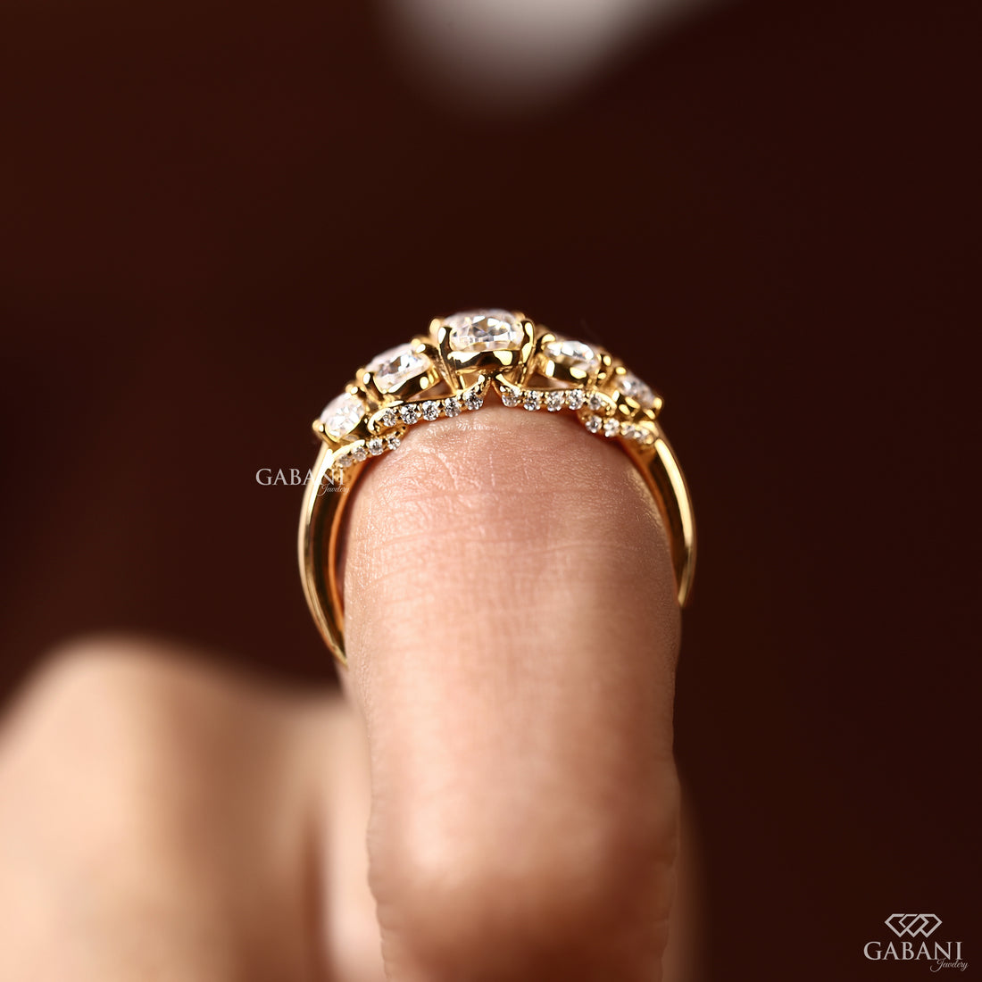 Graduated oval cut diamond ring with lab grown diamond stones