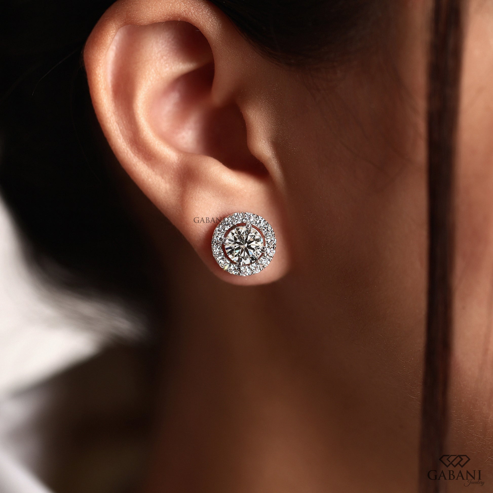 Halo stud earrings featuring round EF VVS lab grown diamonds
