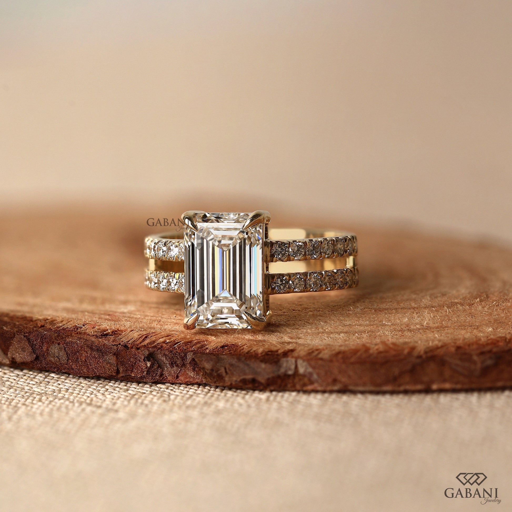 14k gold engagement ring with emerald cut lab grown center stone
